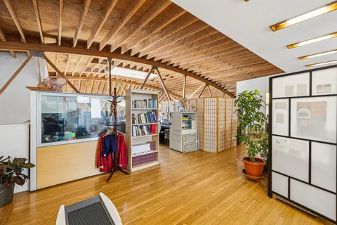 a kitchen with stainless steel appliances granite countertop a stove and cabinets