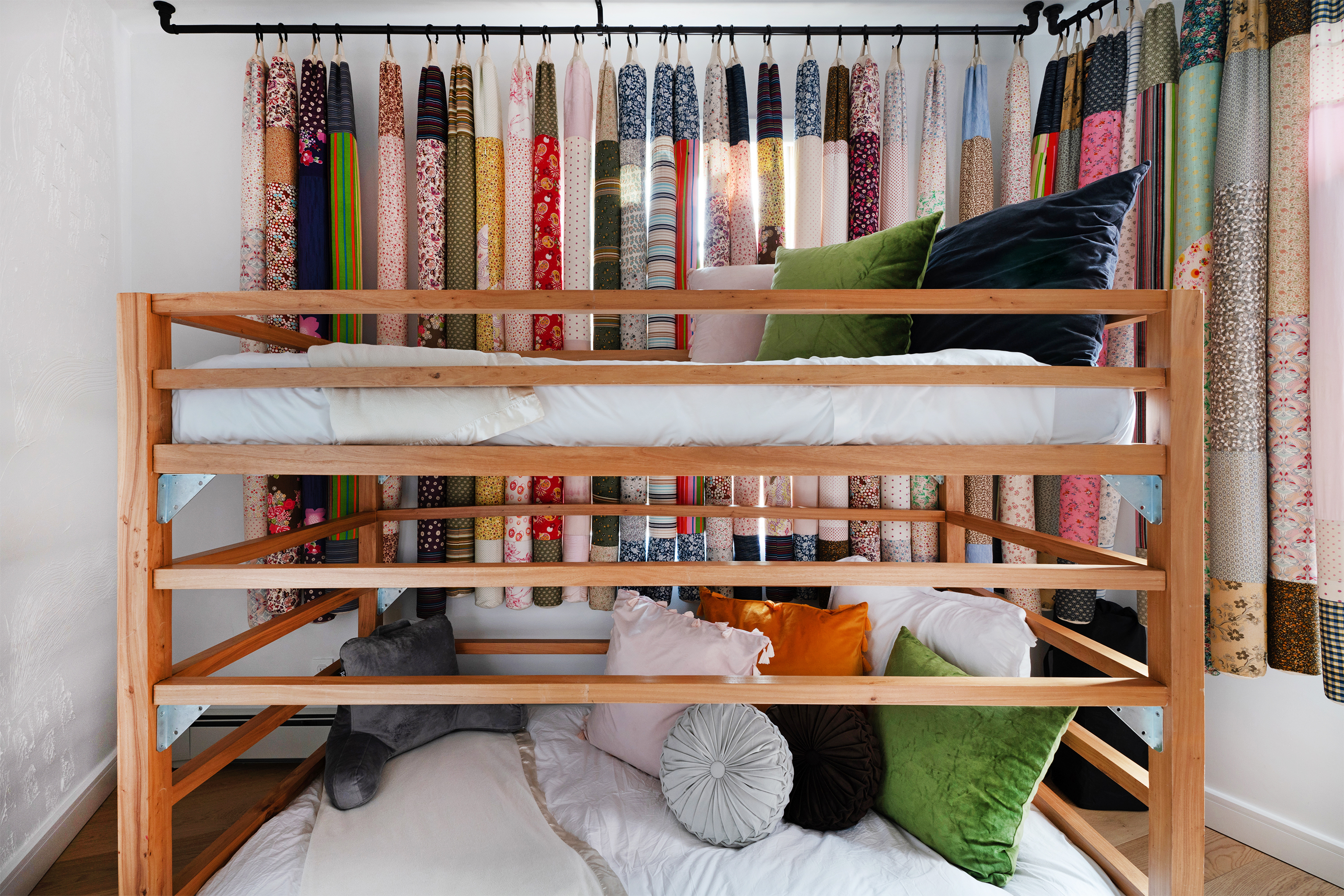 334 Plymouth Street, Unit PH Brooklyn, NY 11201 - Photo 11 of 16 a living room with furniture a bookshelf and a window