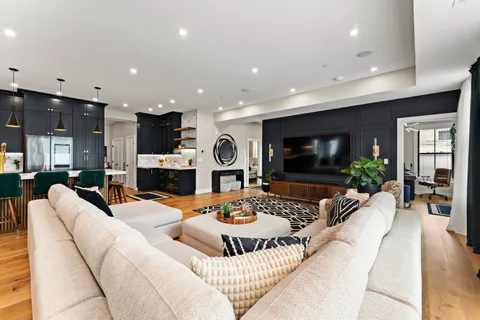 a living room with fireplace furniture and a flat screen tv
