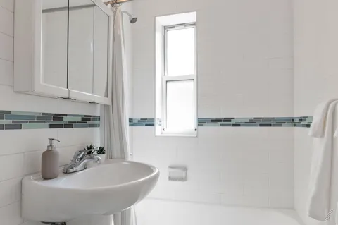 a bathroom with a sink and a bathtub