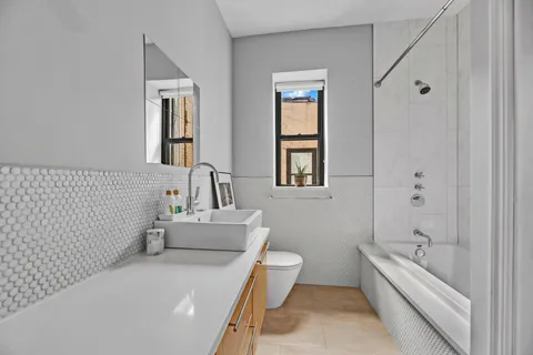 a bathroom with a bathtub sink and toilet