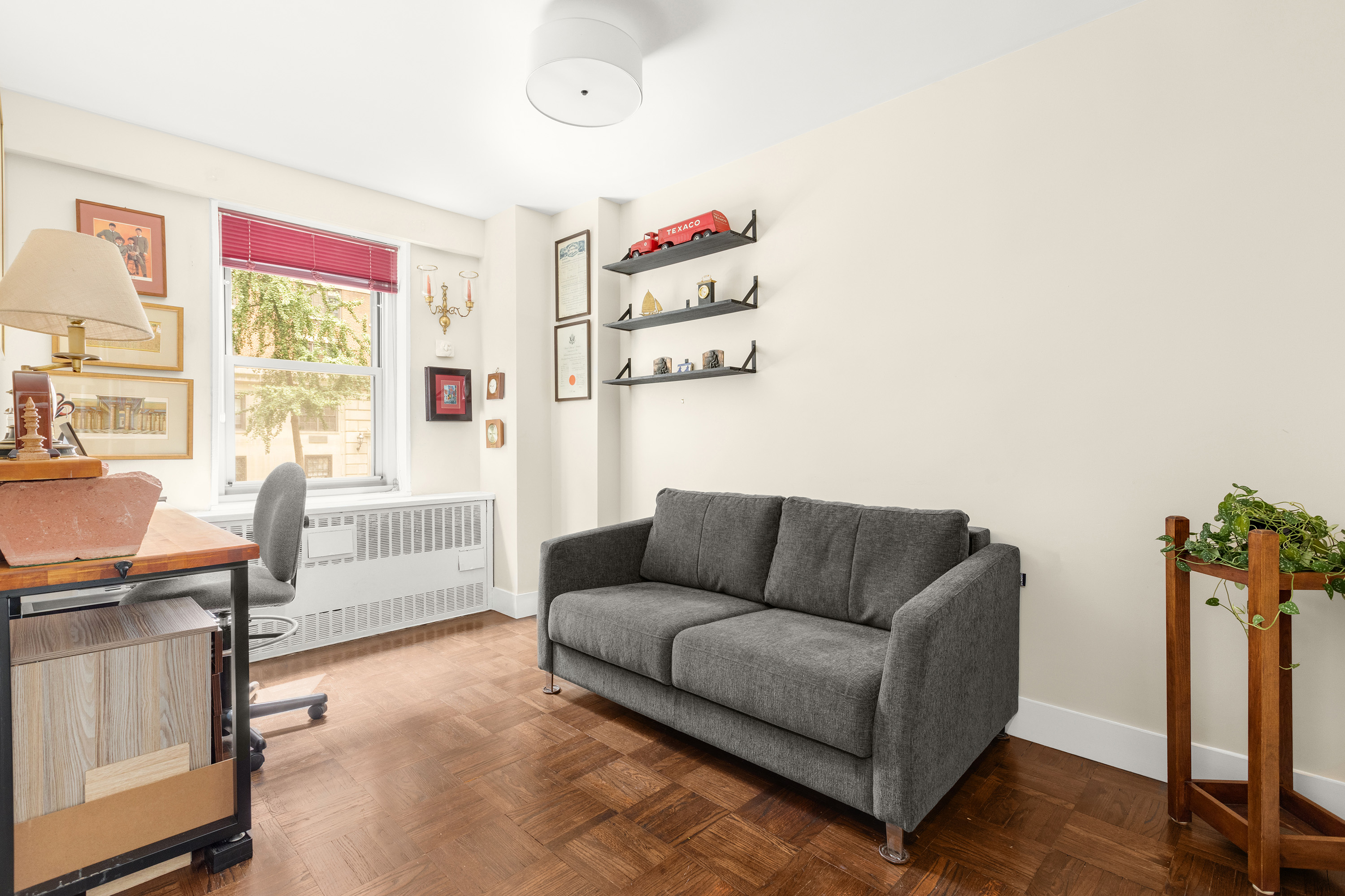 525 East 86th Street, Unit 2G Manhattan, NY 10028 - Photo 4 of 12 a living room with furniture and a window