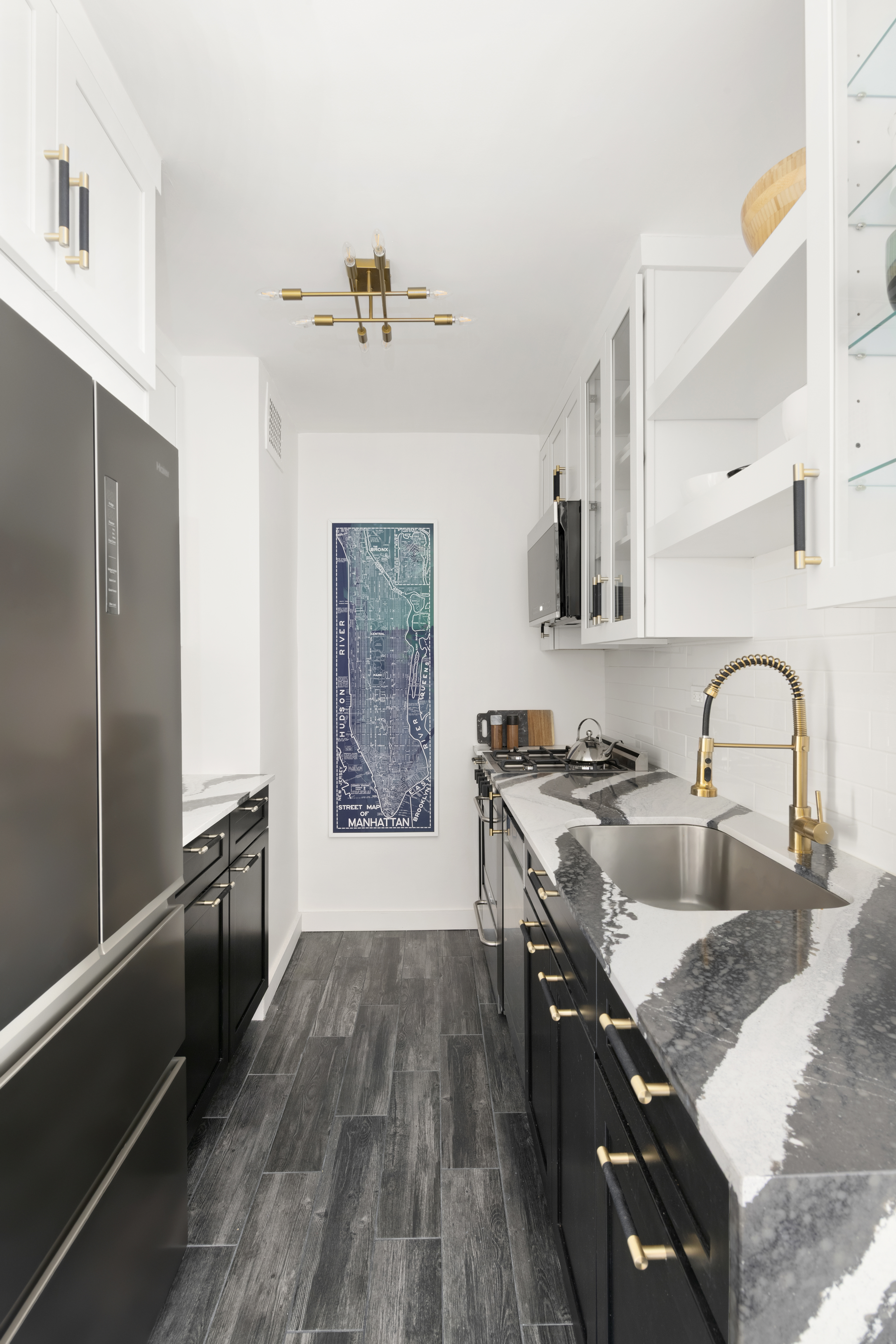 185 West End Avenue, Unit 11P Manhattan, NY 10023 - Photo 4 of 10 a kitchen with stainless steel appliances granite countertop hardwood floor sink stove and refrigerator