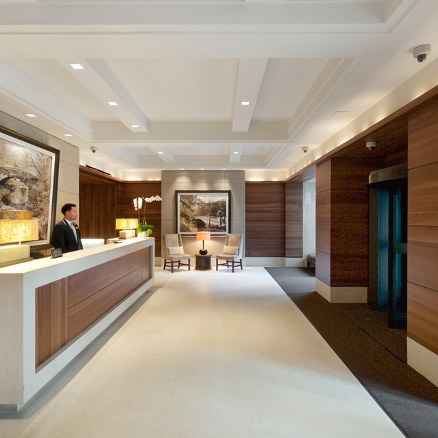 155 West 68th Street, Unit 1907 Manhattan, NY 10023 - Photo 14 of 20 a large white room with a large window and furniture