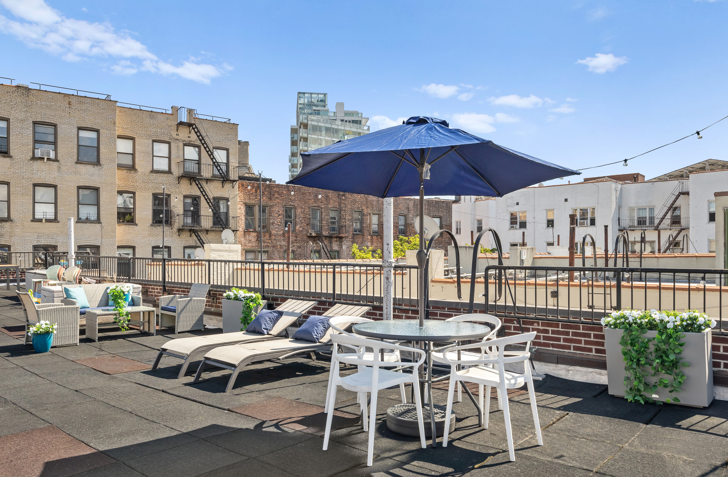 26 Butler Place, Unit 48 Brooklyn, NY 11238 - Photo 9 of 14 a patio with a patio table and chairs