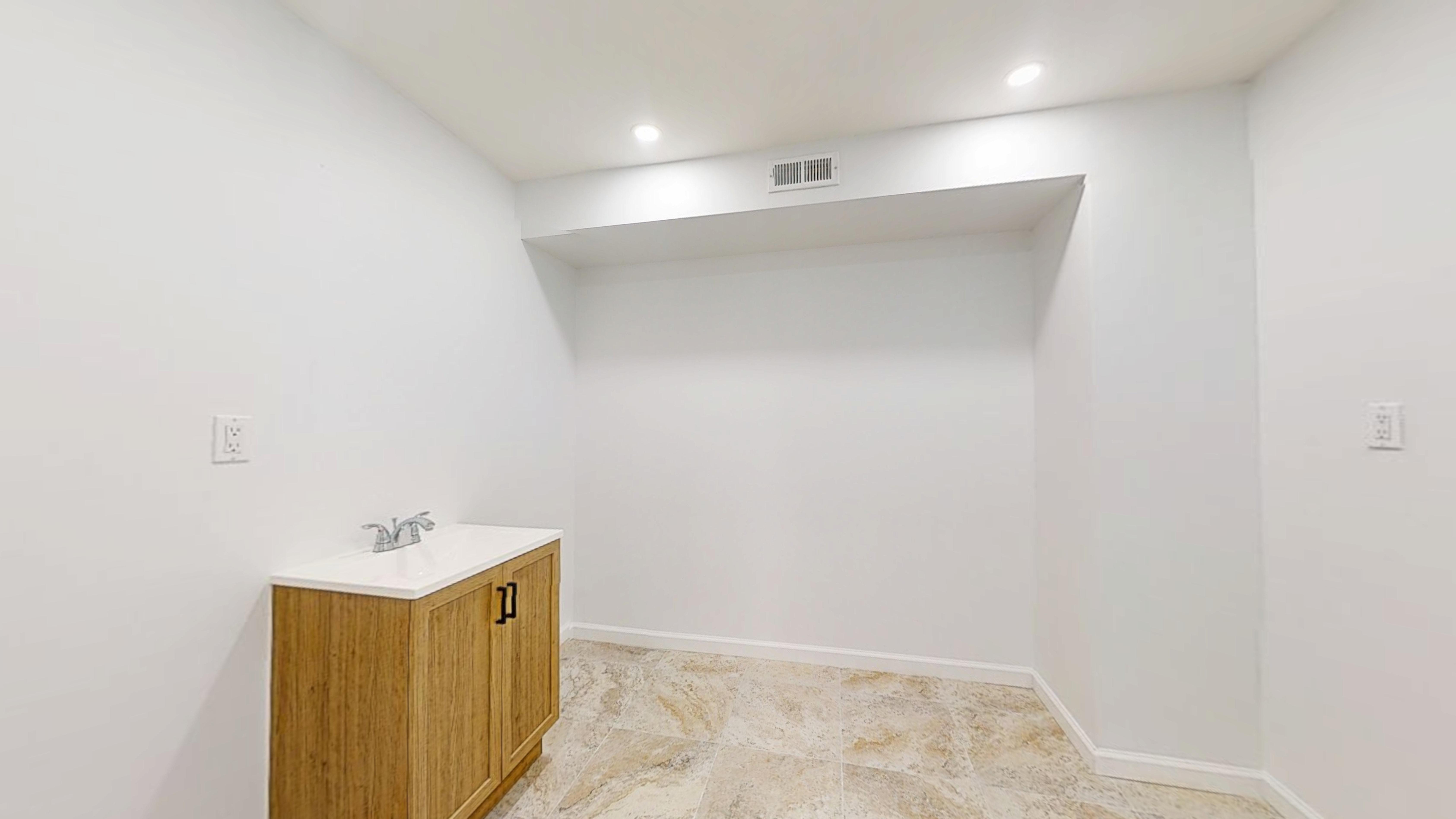 454 77th Street, Unit 1 Brooklyn, NY 11209 - Photo 5 of 10 a view of a bathroom with sink and mirror