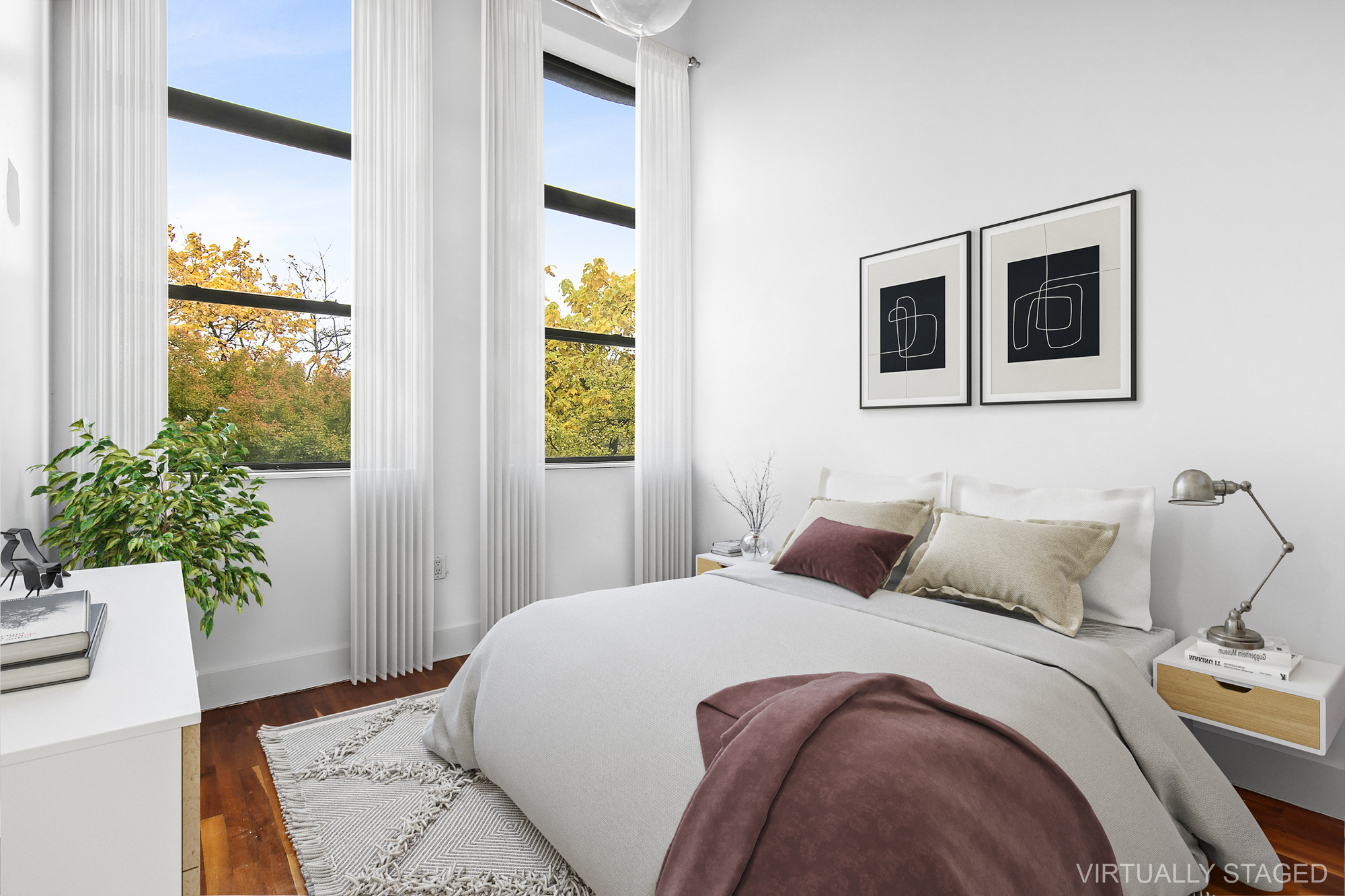 180 Bainbridge Street, Unit 305 Brooklyn, NY 11233 - Photo 4 of 23 a bedroom with a bed and a potted plant