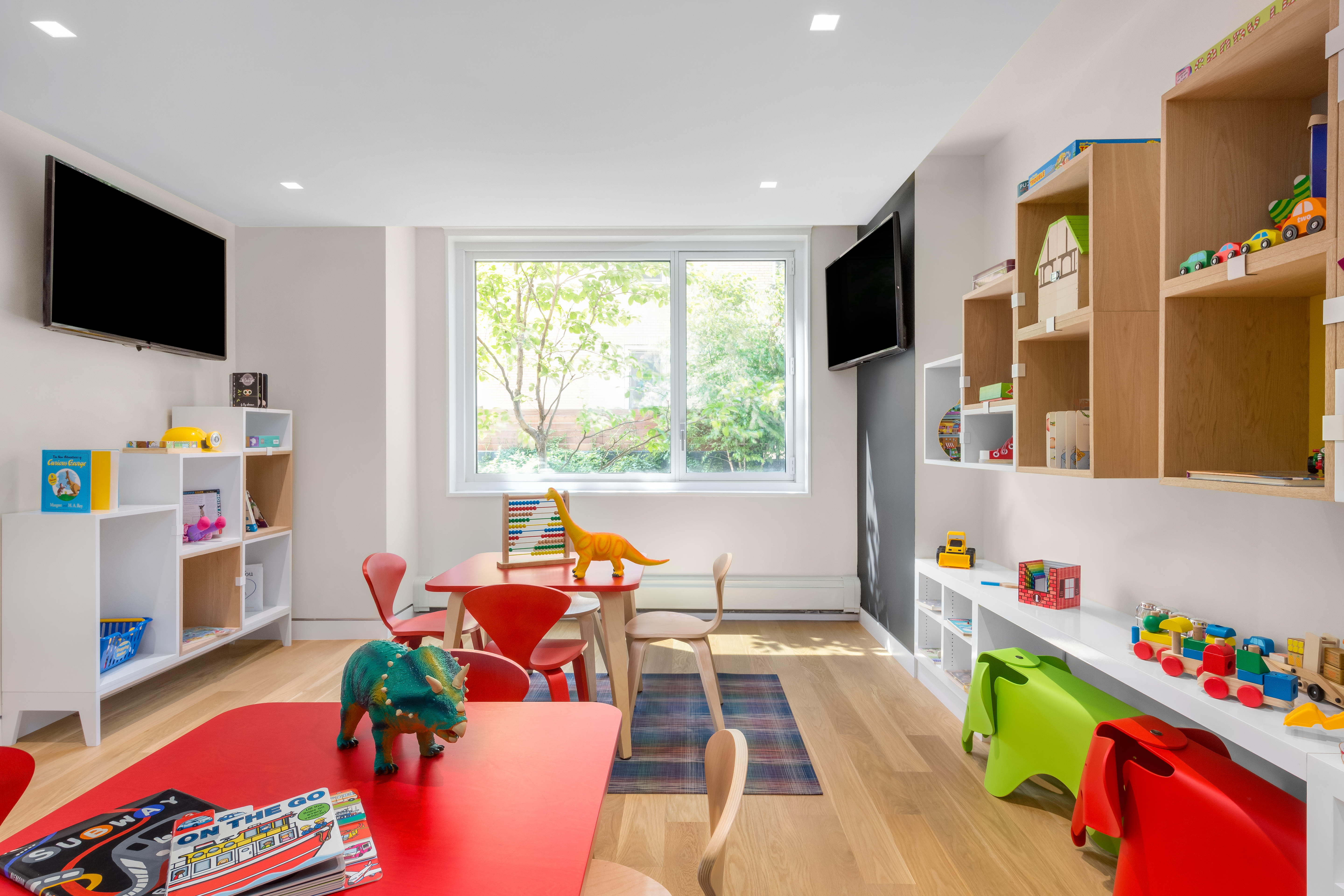 301 West 53rd Street, Unit 13C Manhattan, NY 10019 - Photo 9 of 13 a living room with furniture toys and a flat screen tv