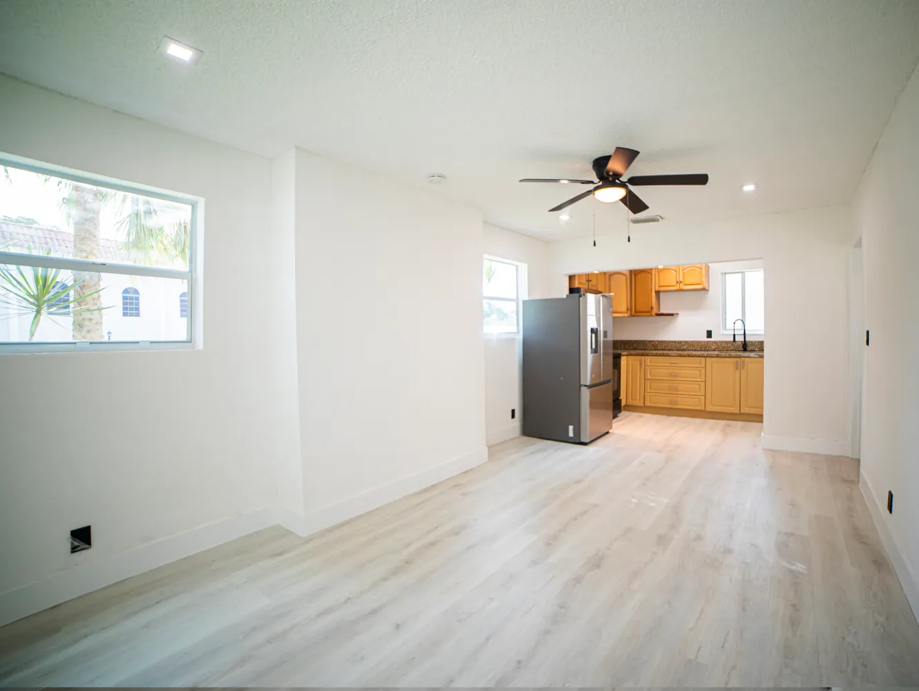 a view of a kitchen with a sink and a window