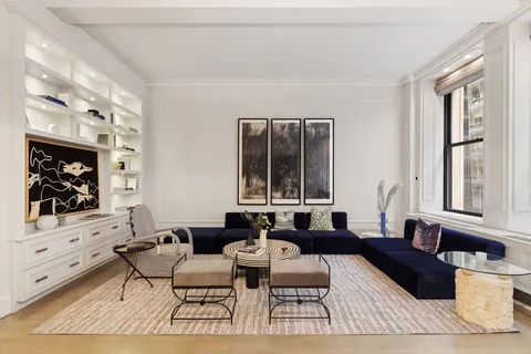 a living room with furniture and window