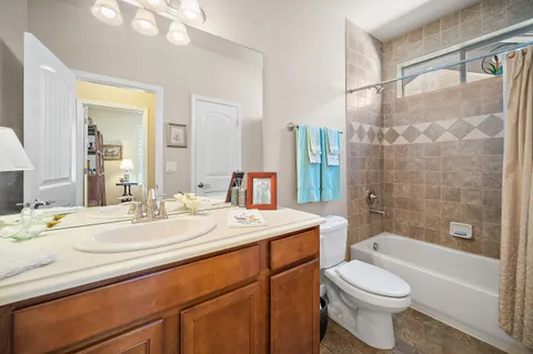 a spacious bathroom with a double vanity sink mirror and