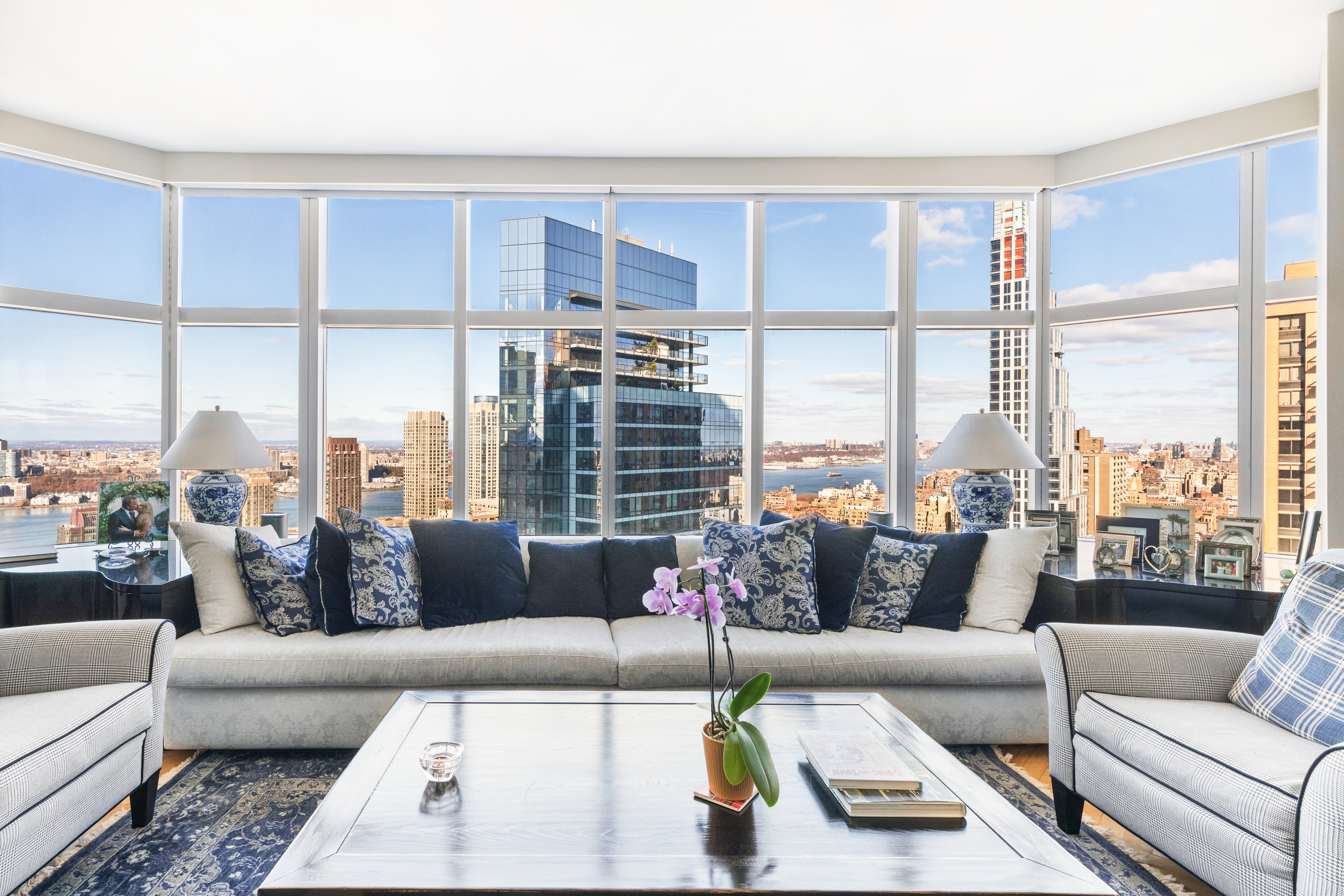160 West 66th Street, Unit 42AB Manhattan, NY 10023 - Photo 2 of 15 a living room with furniture and a large window