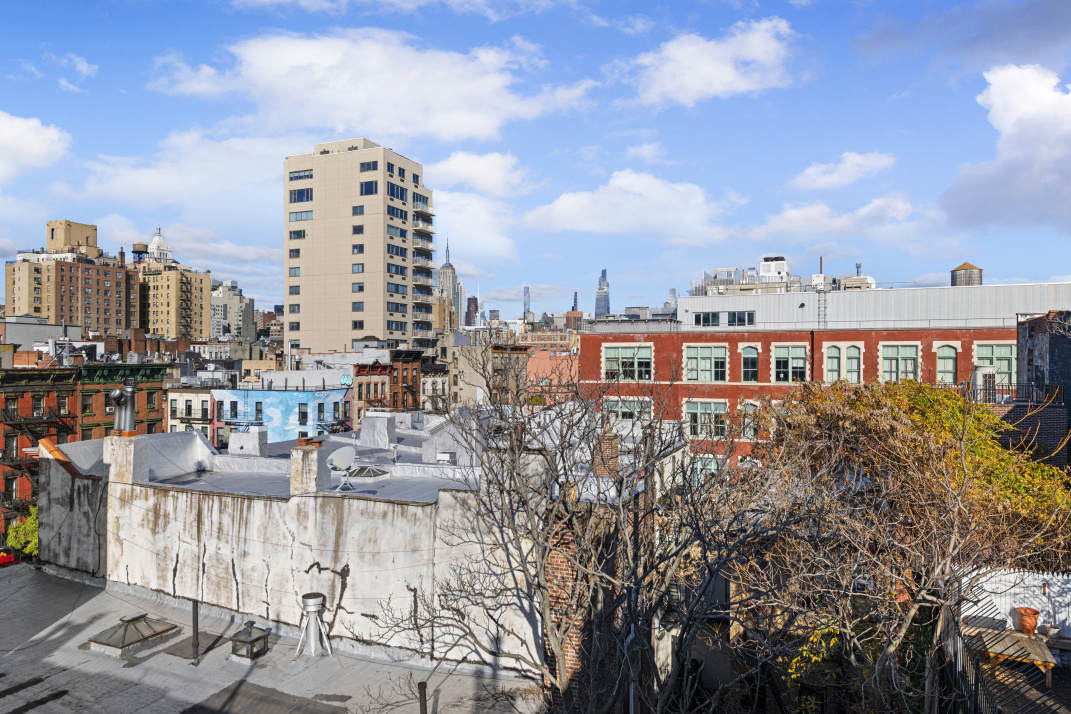 87 St Marks Place, Unit 4E Manhattan, NY 10009 - Photo 7 of 9 a view of a city with tall buildings