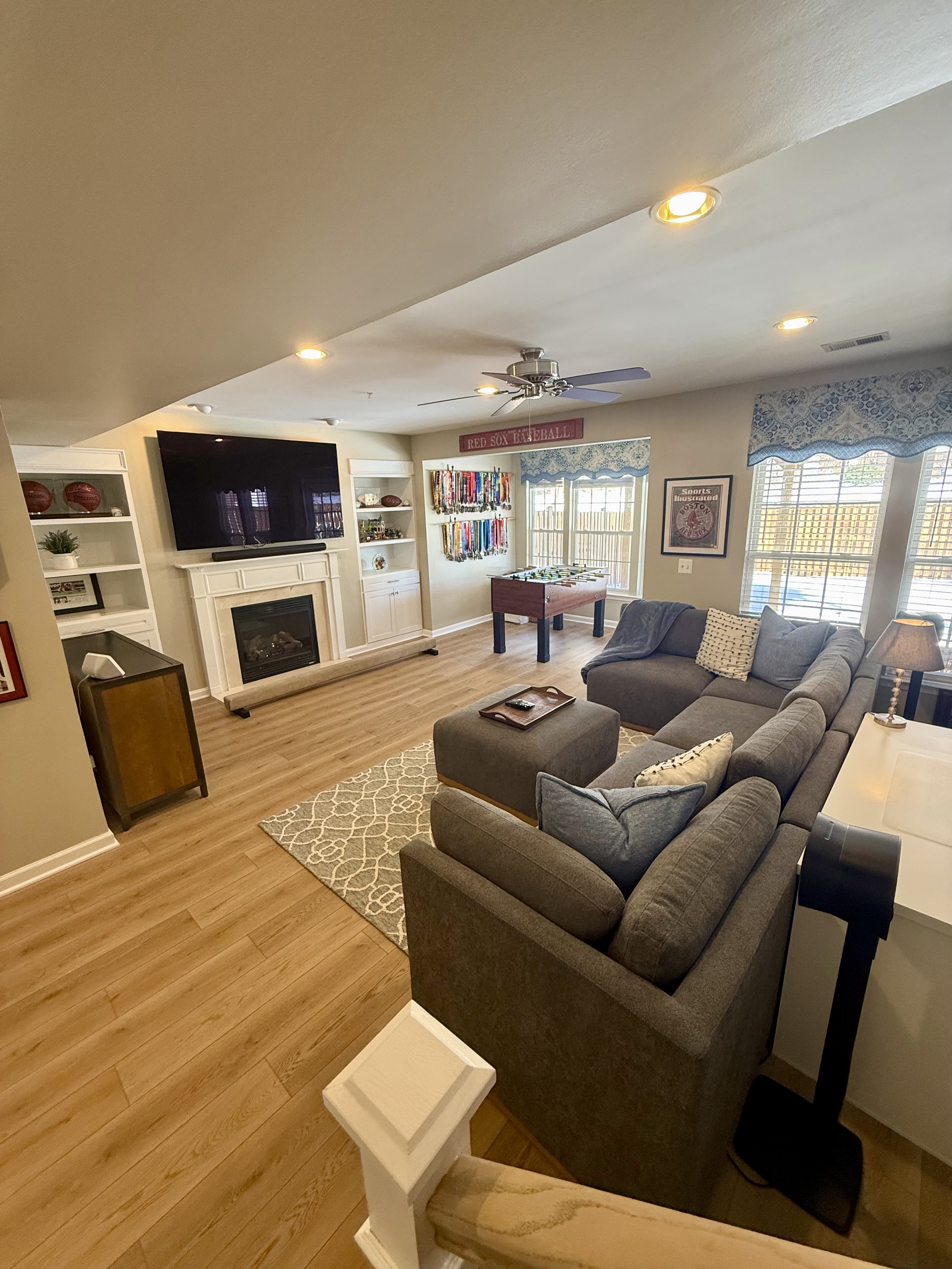 Address Upon Request Leesburg, VA 20176 - Photo 29 of 55 a living room with furniture a flat screen tv and a fireplace