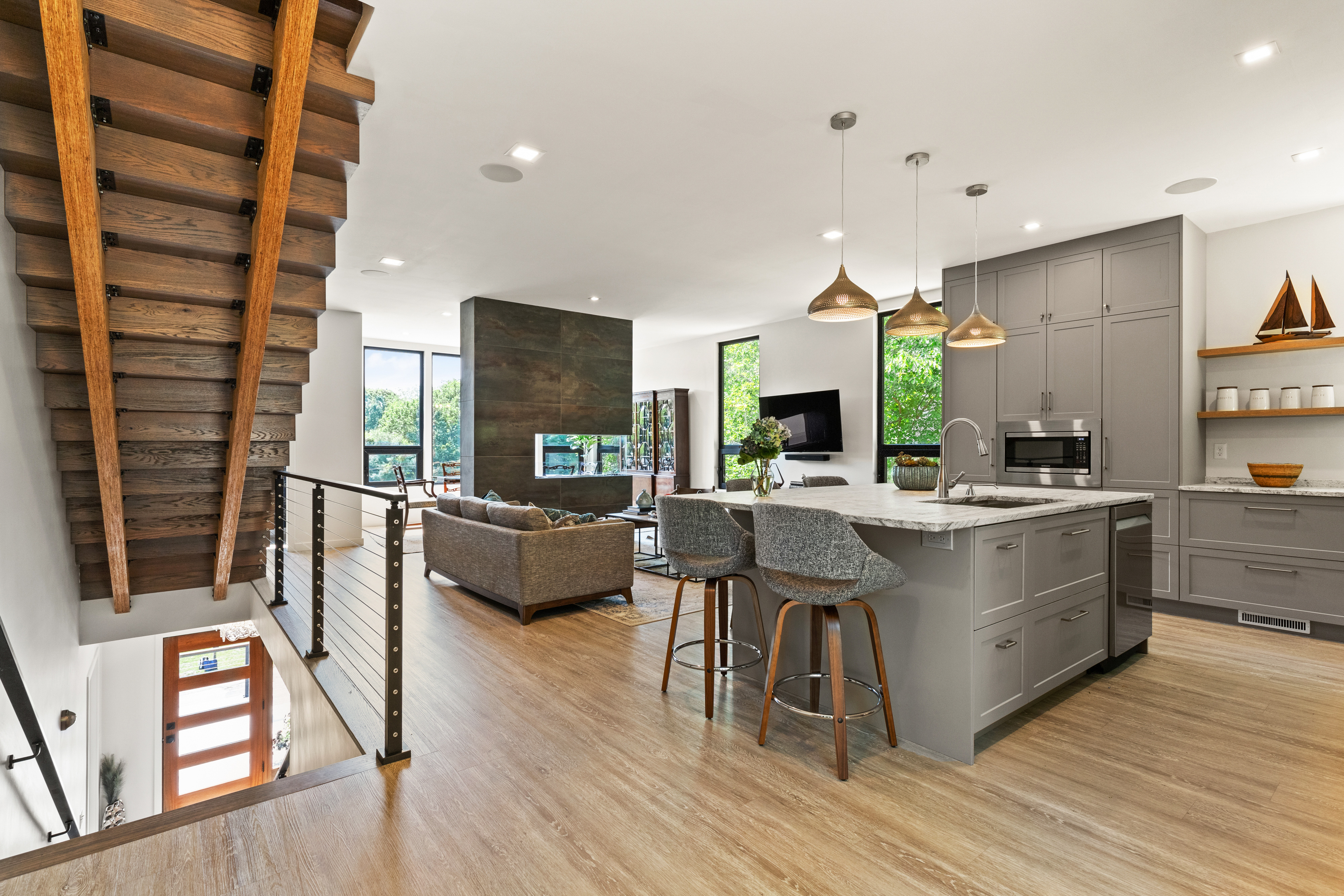7 Pickman Road Beverly, MA 01915 - Photo 4 of 31 a large kitchen with stainless steel appliances kitchen island granite countertop a large window and a living room view