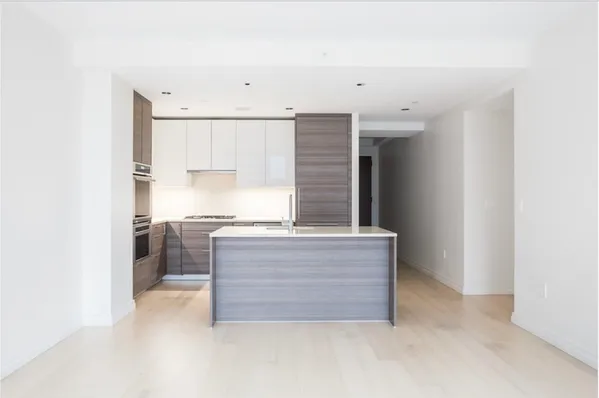 a living room with granite countertop furniture and fireplace