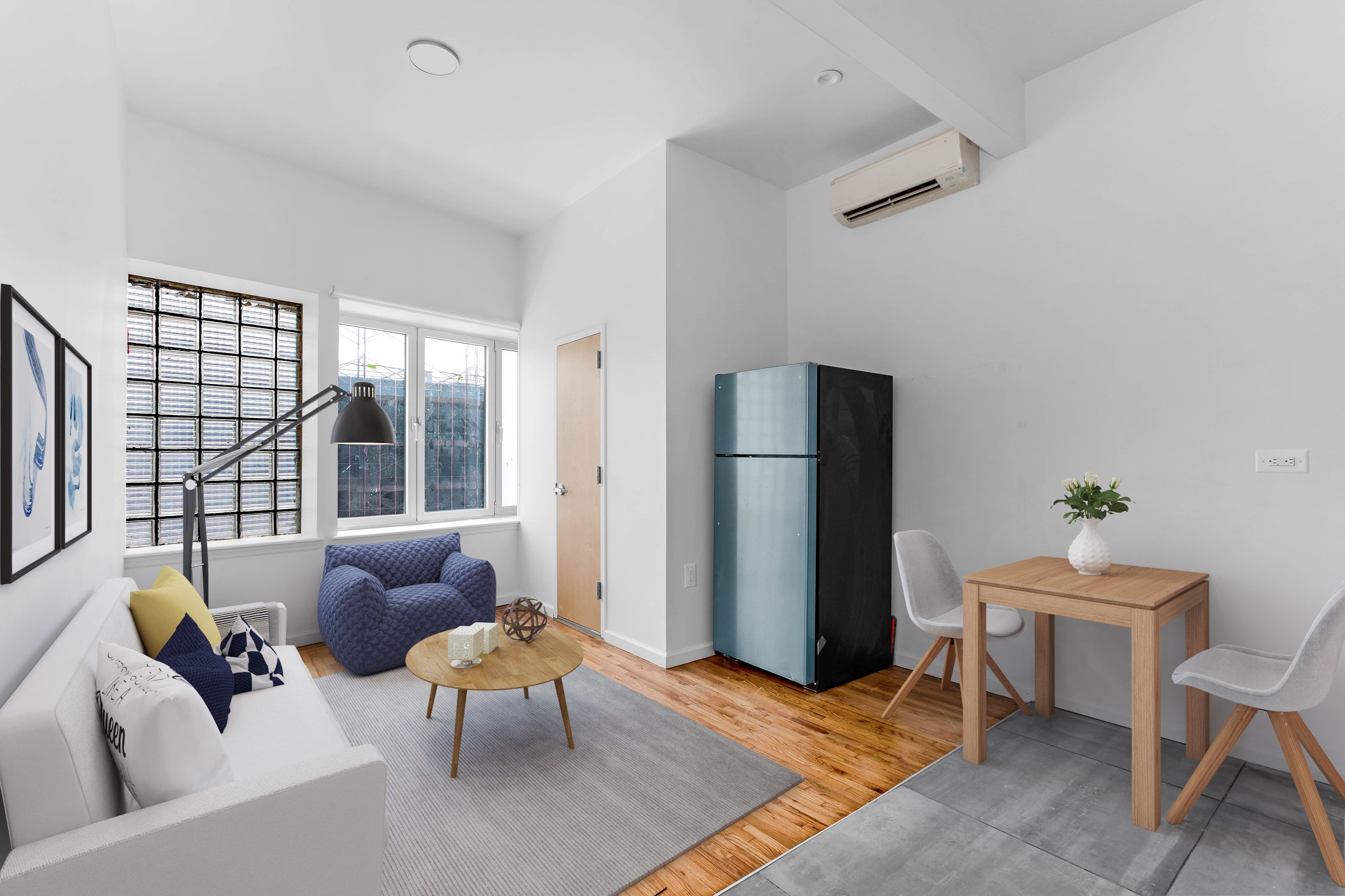 a living room with furniture and a window