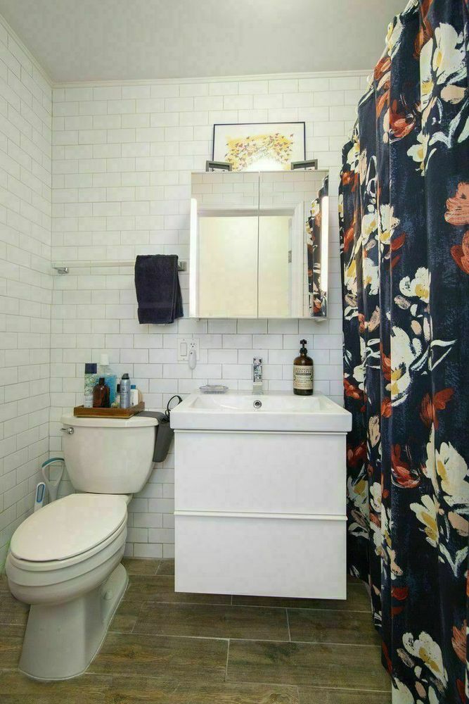 1275 Nostrand Avenue, Unit 2R Brooklyn, NY 11226 - Photo 6 of 6 a bathroom with a toilet sink and mirror