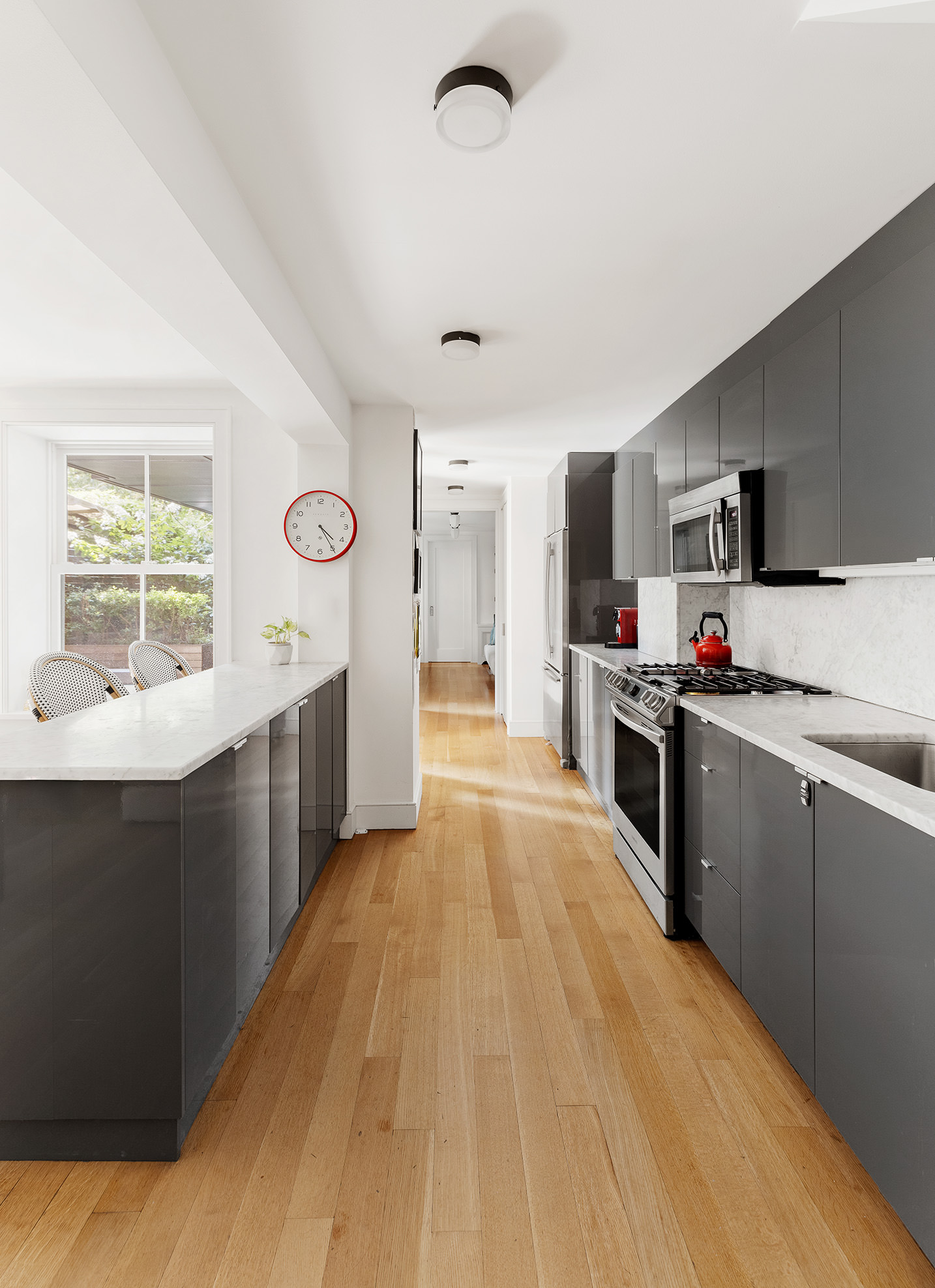 6 Strong Place, Unit GARDEN Brooklyn, NY 11231 - Photo 3 of 10 a large kitchen with stainless steel appliances granite countertop a stove and a sink