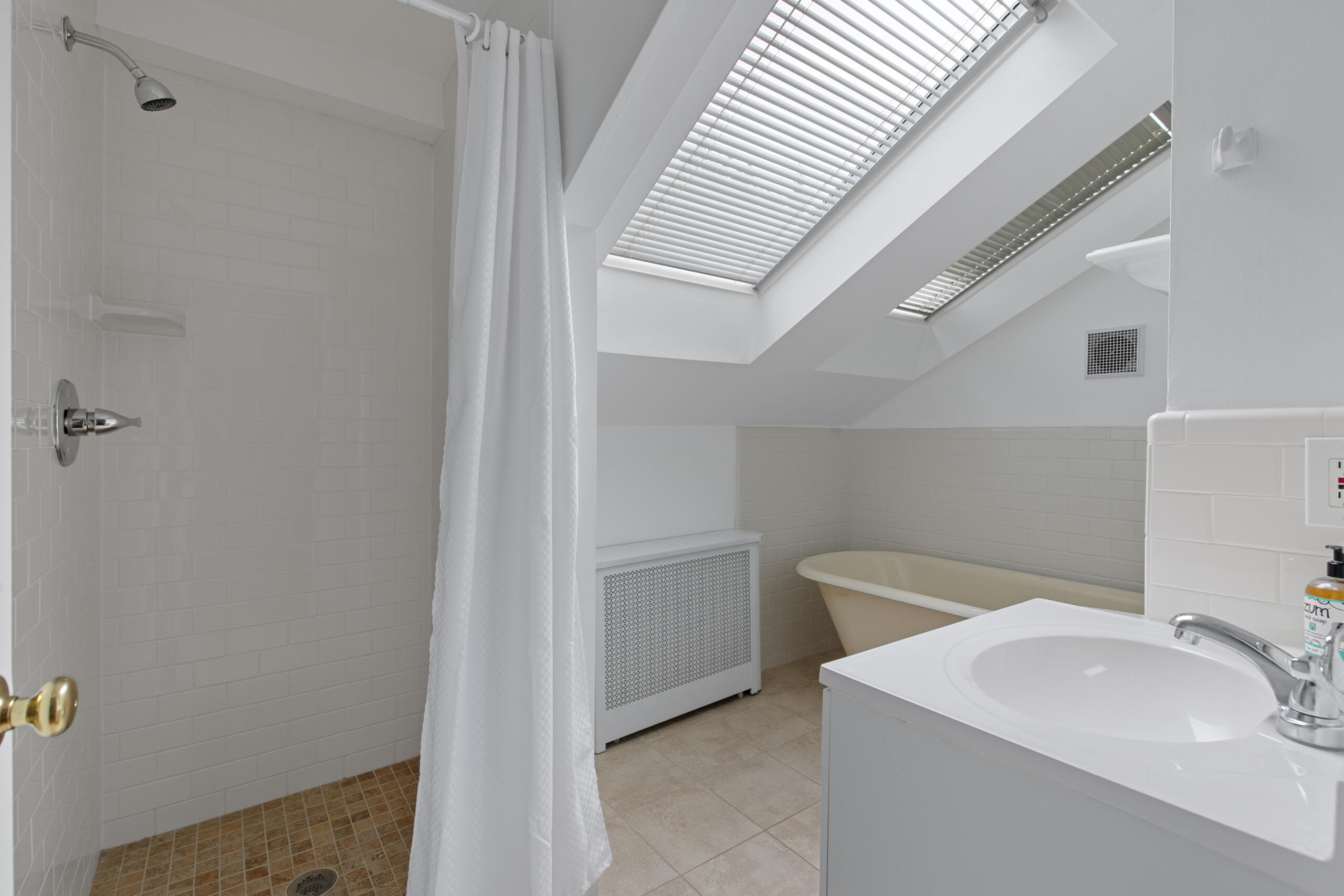 1908 Glen Ross Road Silver Spring, MD 20910 - Photo 39 of 63 a bathroom with a sink a toilet and shower