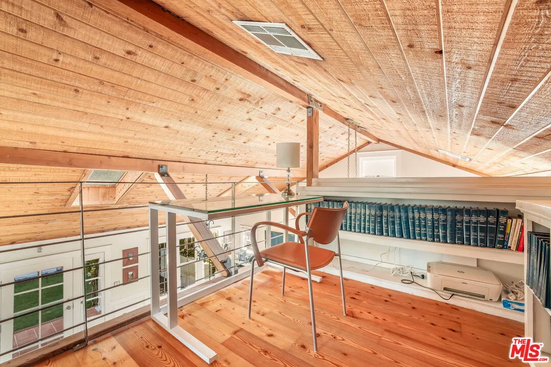 a view of a balcony with wooden floor