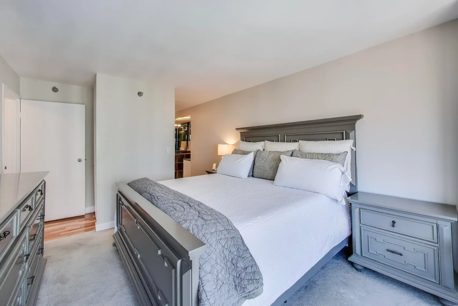 a bedroom with a bed and a cabinets