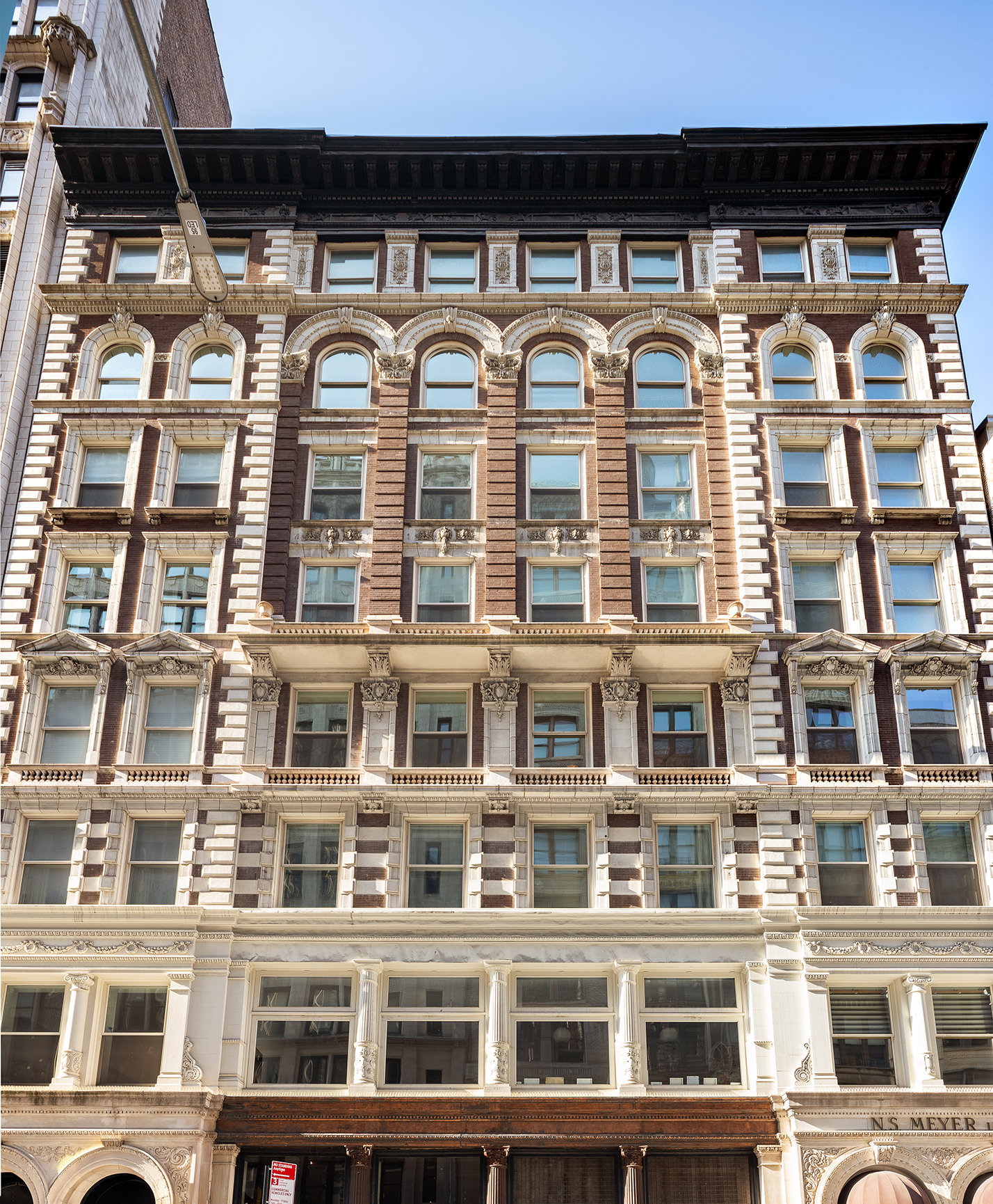 42 East 20th Street, Unit 4AD Manhattan, NY 10003 - Photo 18 of 19 a front view of a building with a lot of windows