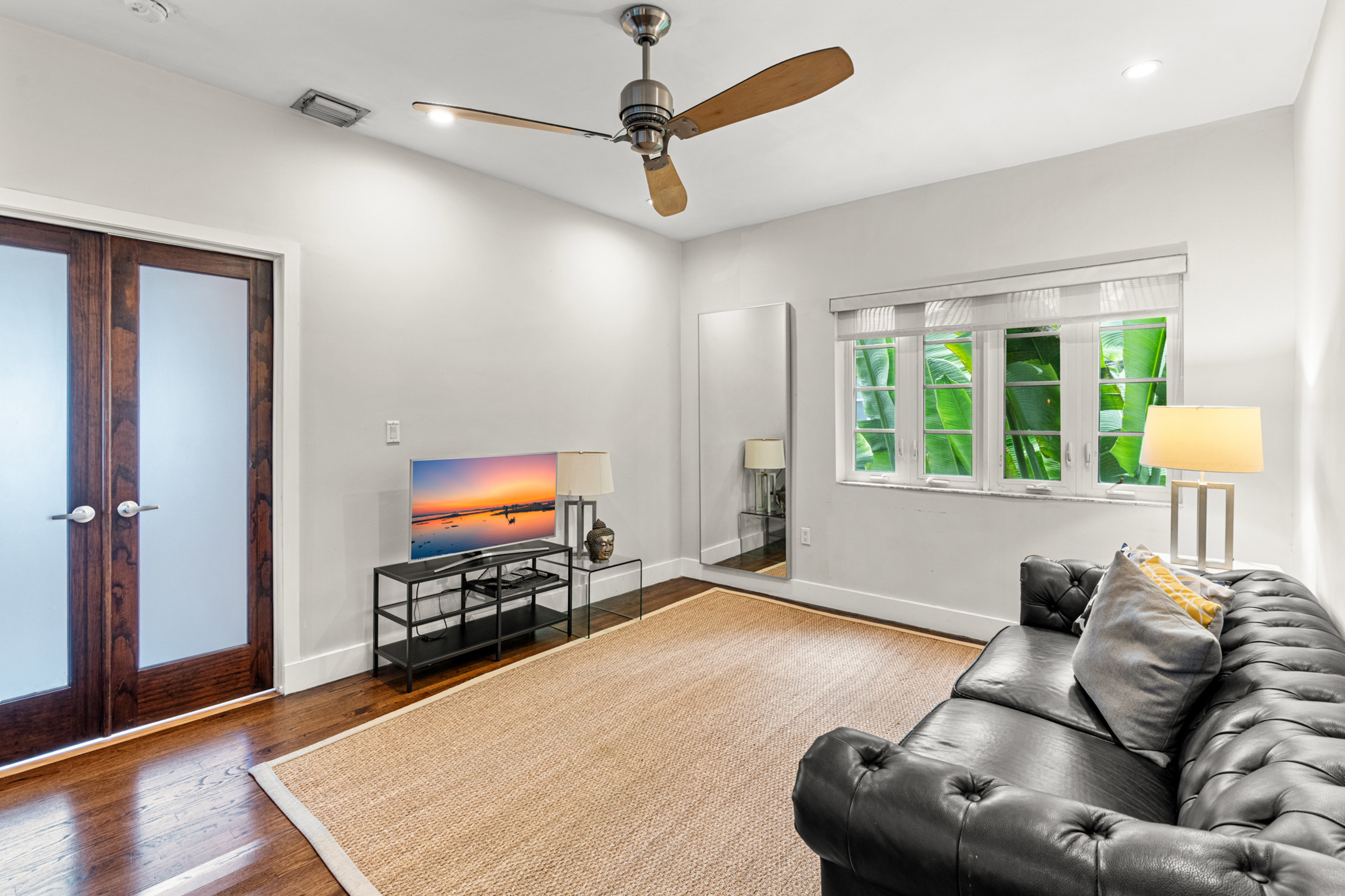 711 East 14th Street, Unit 7 Hialeah, FL 33010 - Photo 13 of 36 a living room with furniture and a flat screen tv