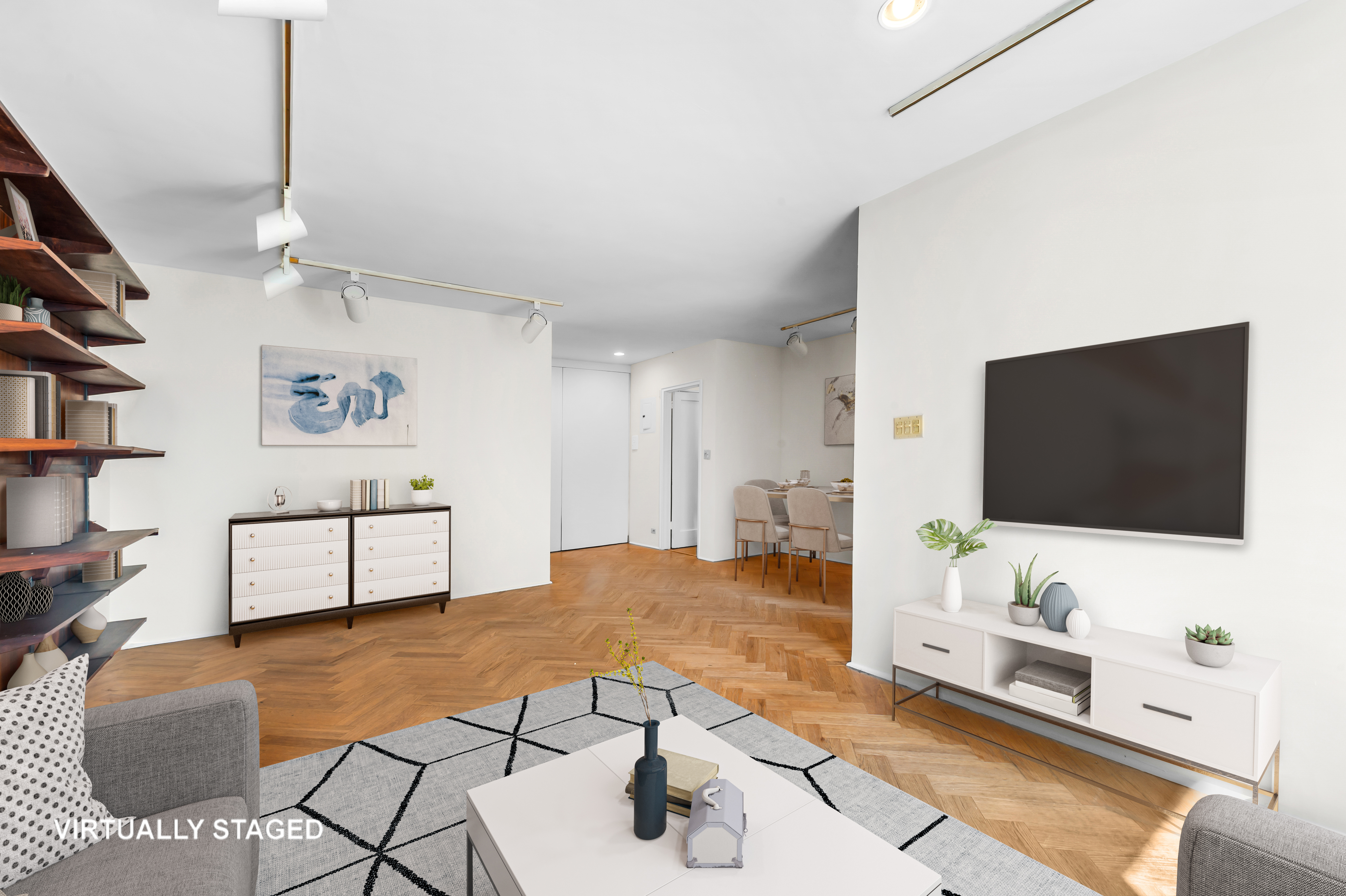 263 West End Avenue, Unit 5B Manhattan, NY 10023 - Photo 5 of 9 a living room with furniture and a flat screen tv