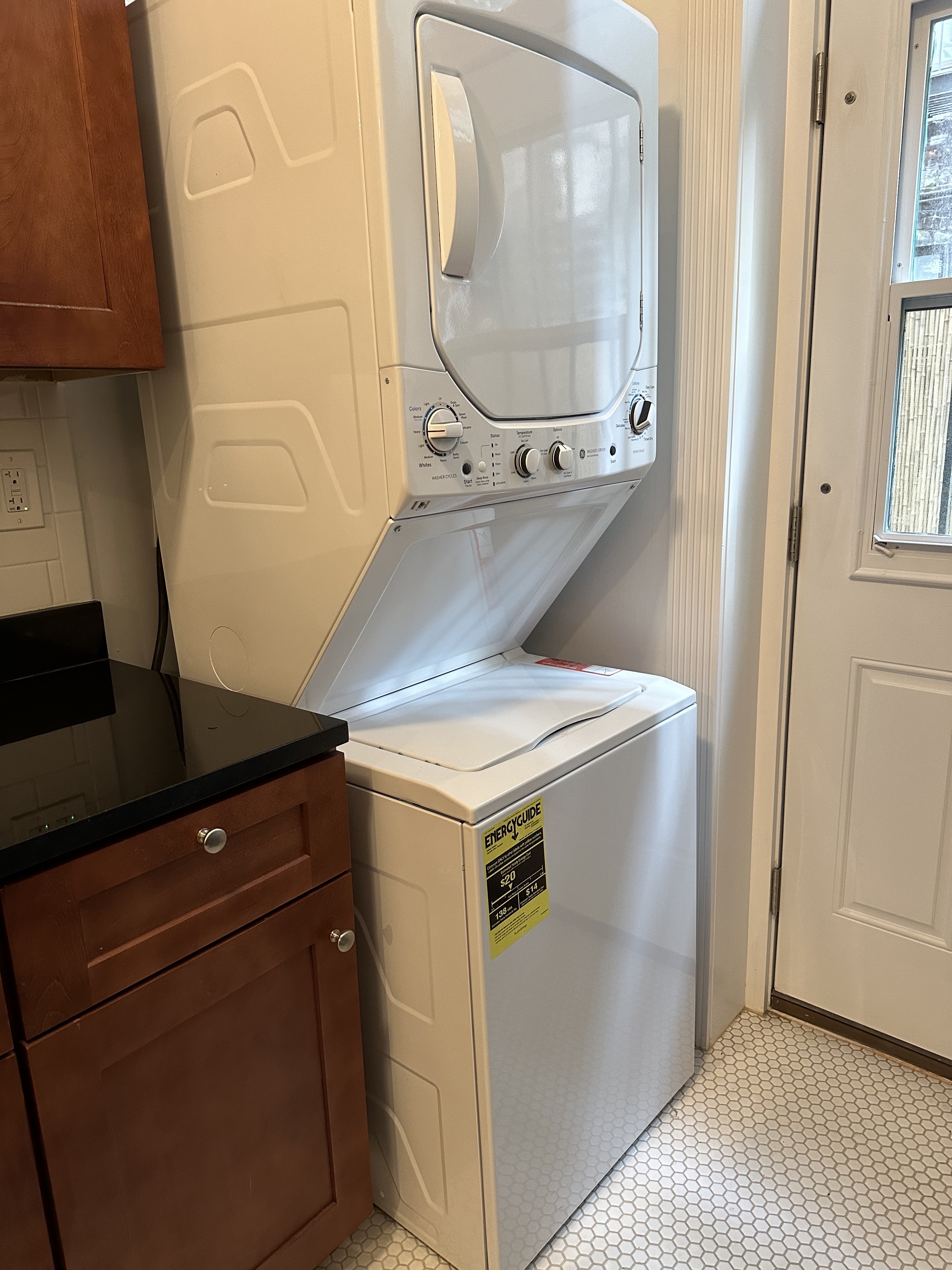 459 West 35th Street, Unit 1E Manhattan, NY 10001 - Photo 14 of 18 a utility room with dryer and washer
