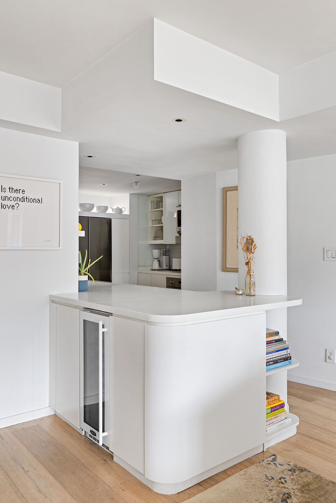 357 West 12th Street, Unit 5E Manhattan, NY 10014 - Photo 5 of 13 a view of kitchen with stainless steel appliances kitchen island sink refrigerator and microwave