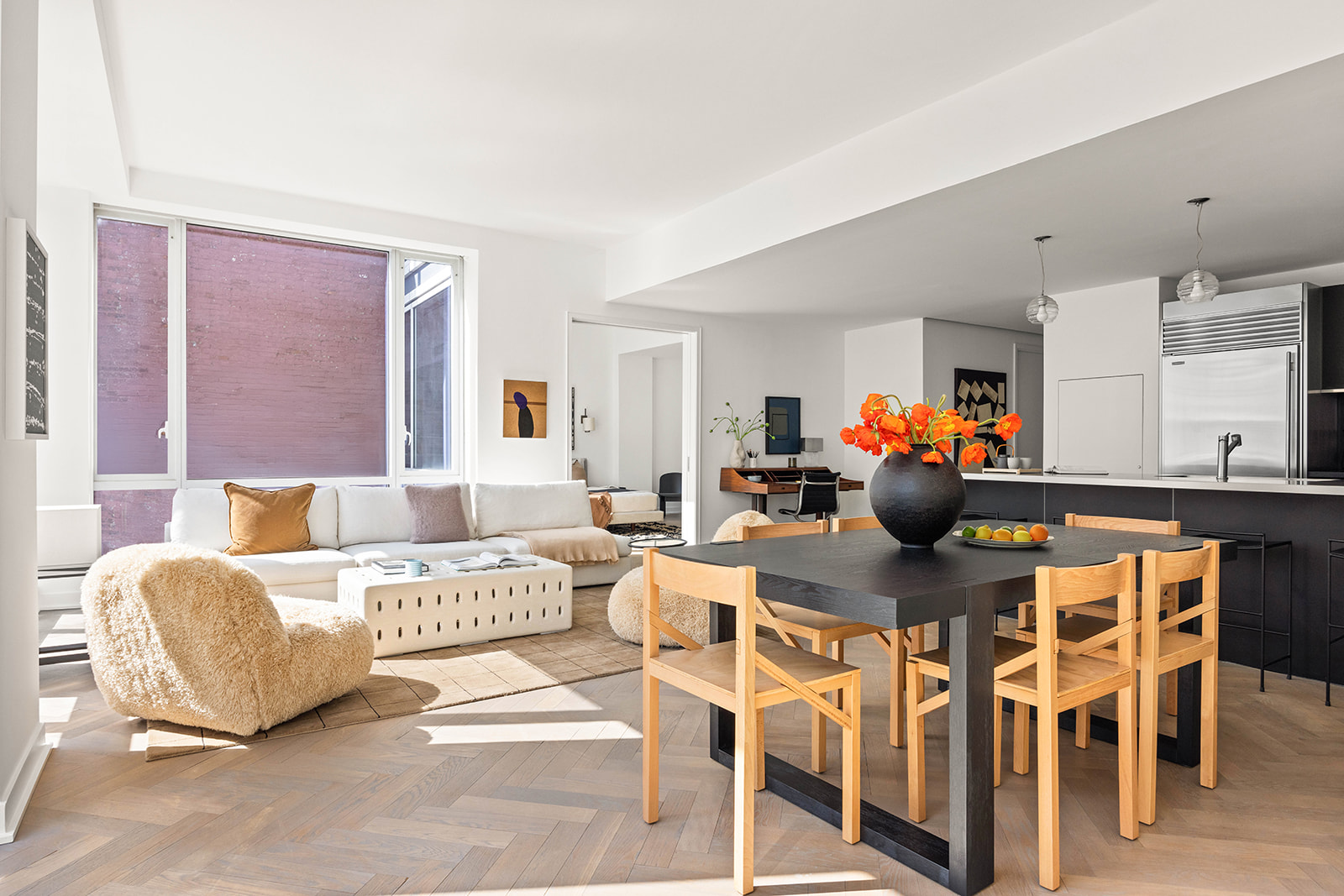 330 Spring Street, Unit 7D Manhattan, NY 10013 - Photo 3 of 11 a living room with furniture a rug and a table