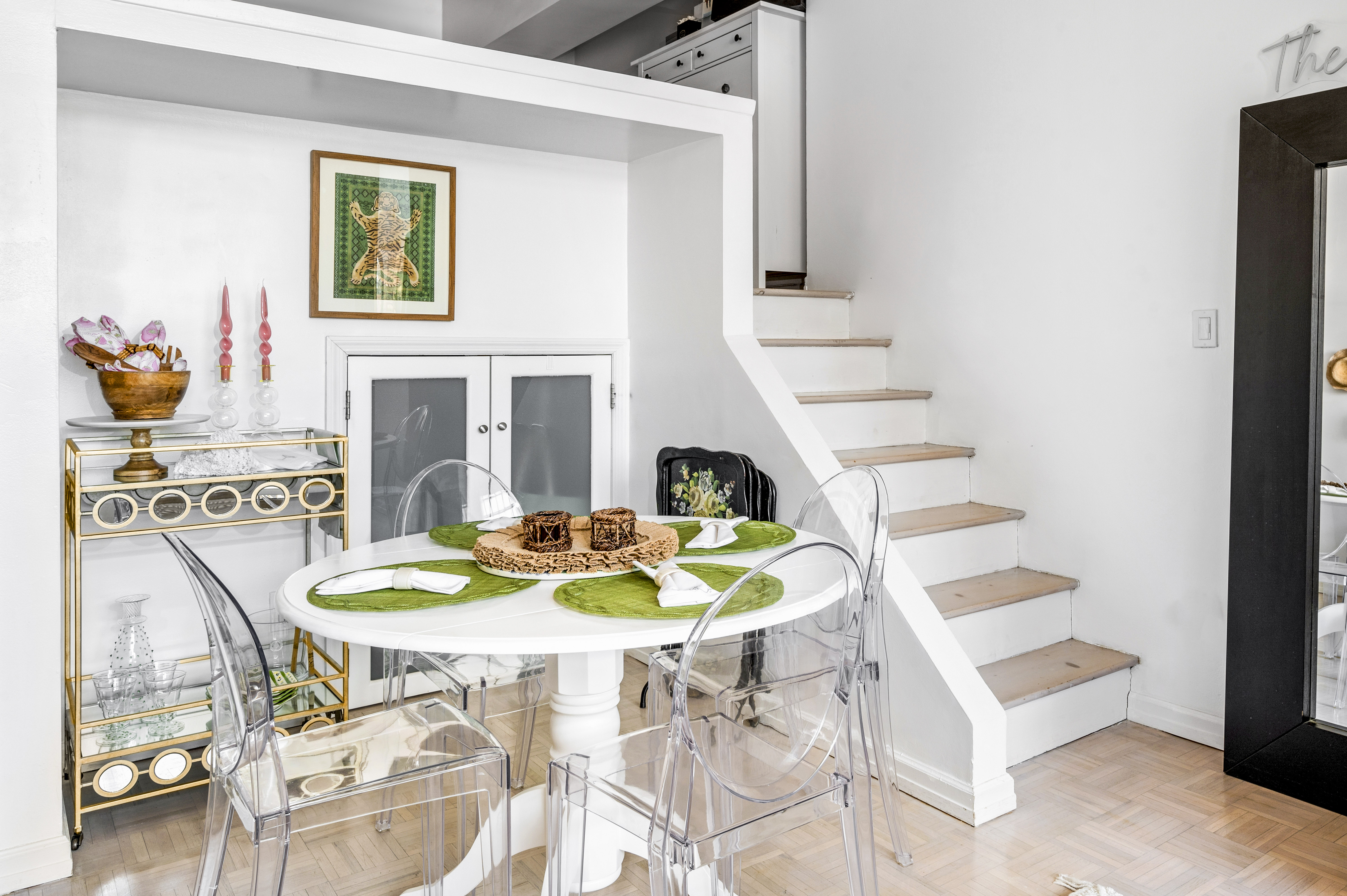 310 East 46th Street, Unit 19F Manhattan, NY 10017 - Photo 4 of 17 a dining room with furniture and a fireplace