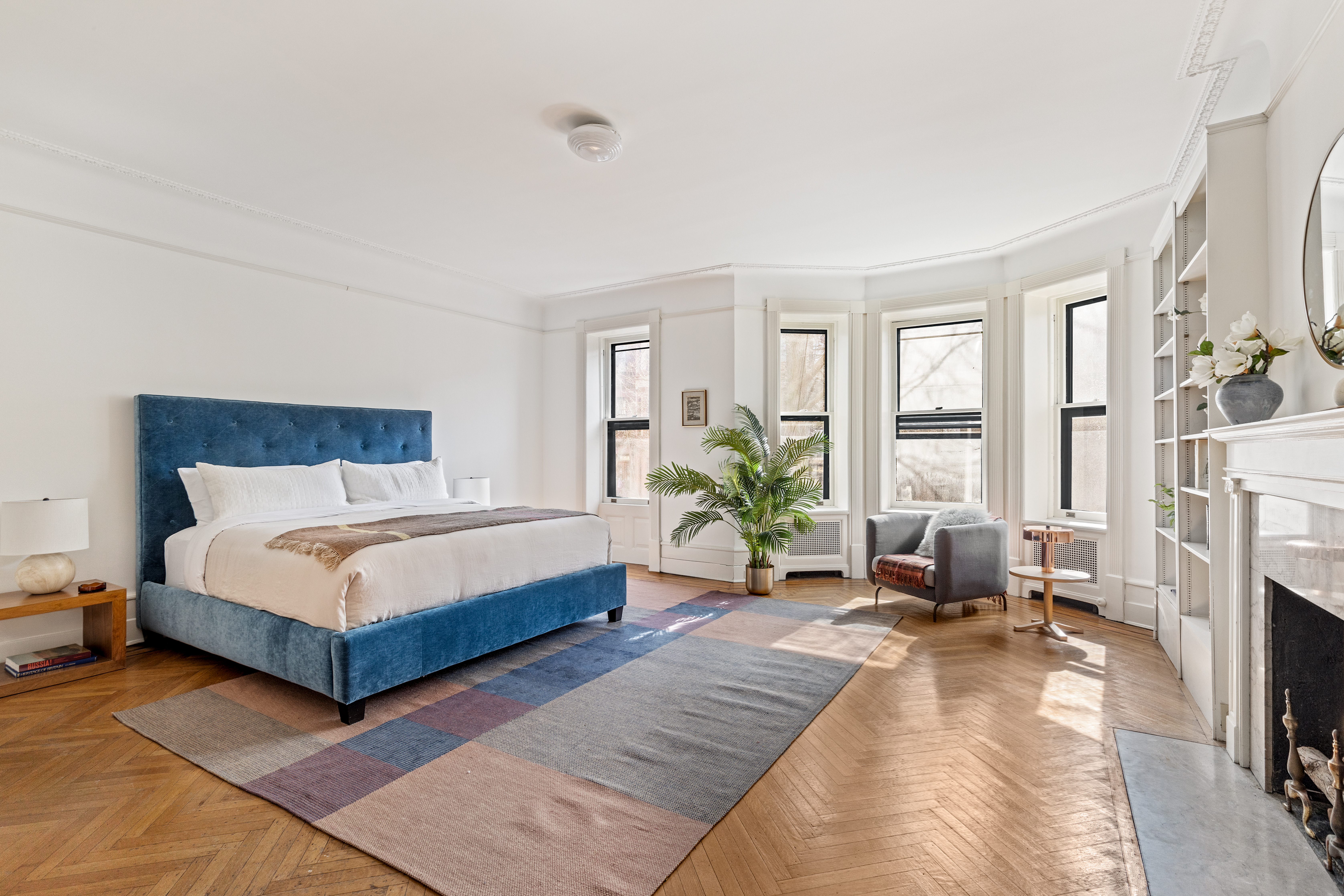 599 2nd Street Brooklyn, NY 11215 - Photo 8 of 16 a bedroom with a bed couch and windows