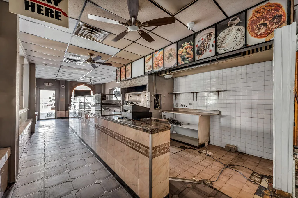 a picture of a room with a white wall and a picture of it