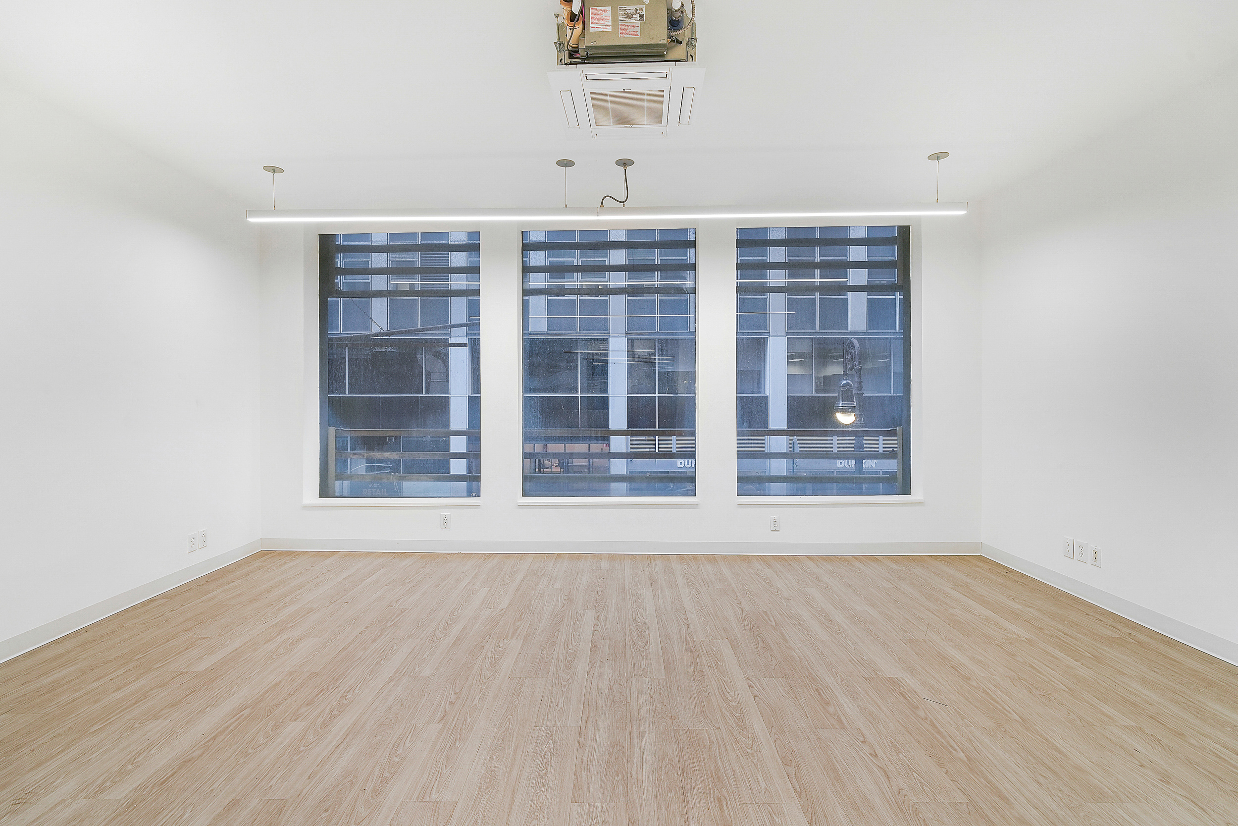 24 Beaver Street Manhattan, NY 10004 - Photo 10 of 25 a view of an empty room with a window