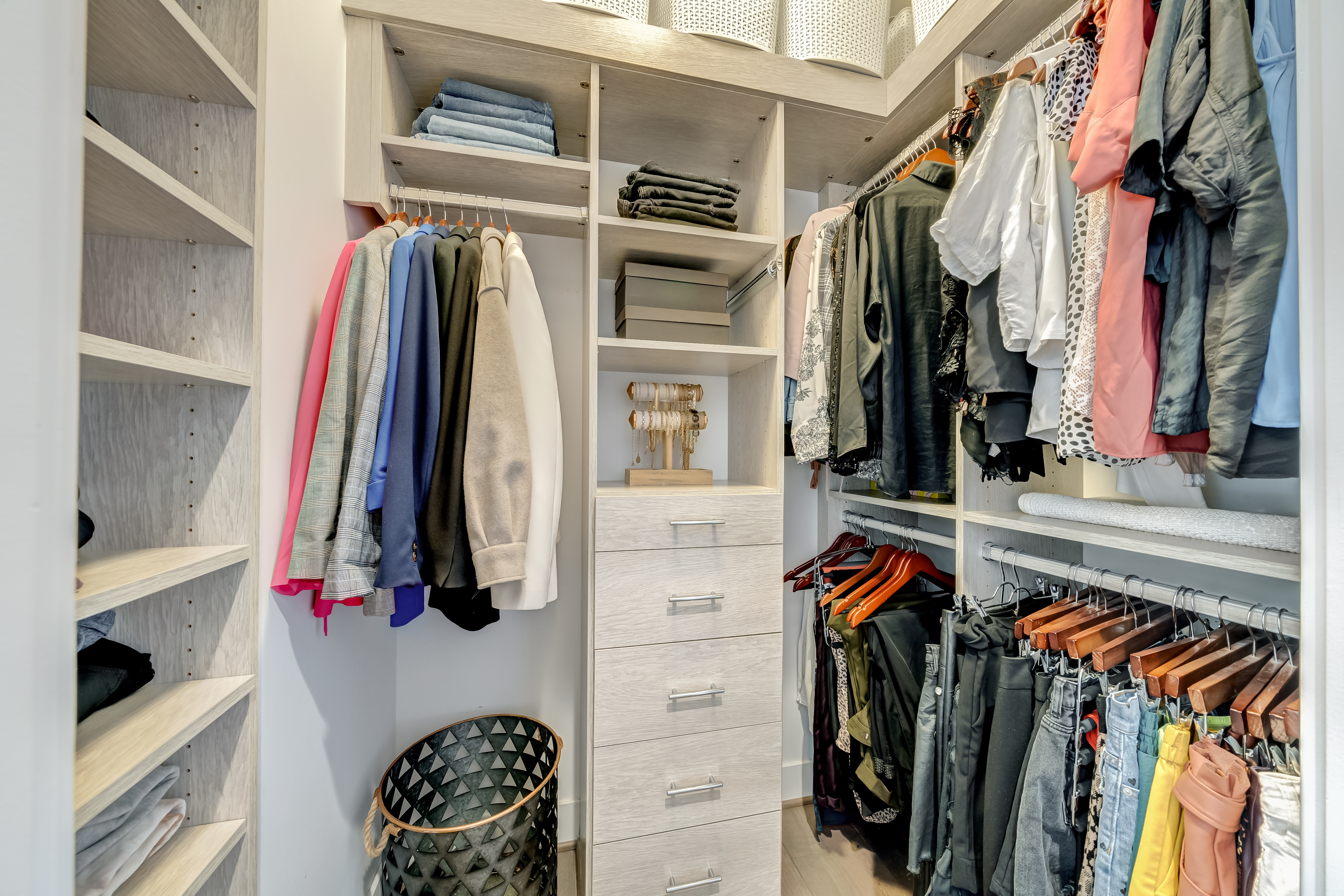 45 Sutton Square Southwest, Unit PH10 Washington, DC 20024 - Photo 27 of 44 a view of walk in closet with clothes and shoes