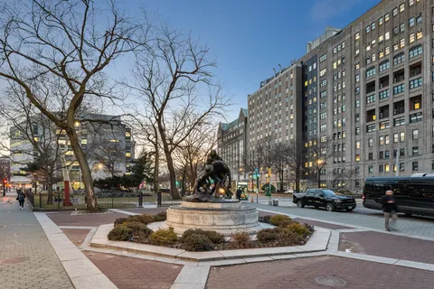 a view of a bedroom with wooden floor
