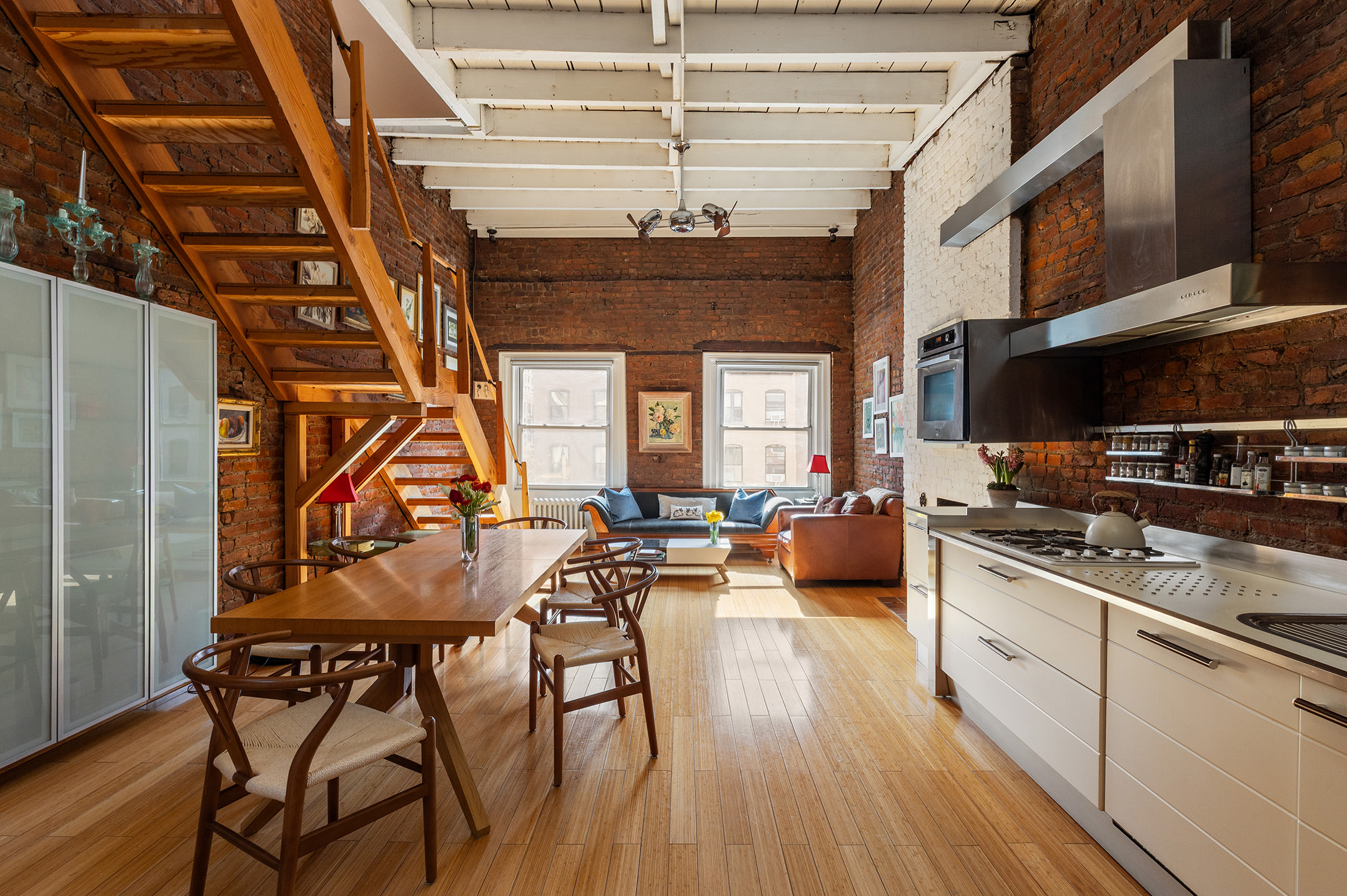 138 Lexington Avenue, Unit PH Manhattan, NY 10016 - Photo 4 of 15 a kitchen with stainless steel appliances granite countertop a stove and cabinets