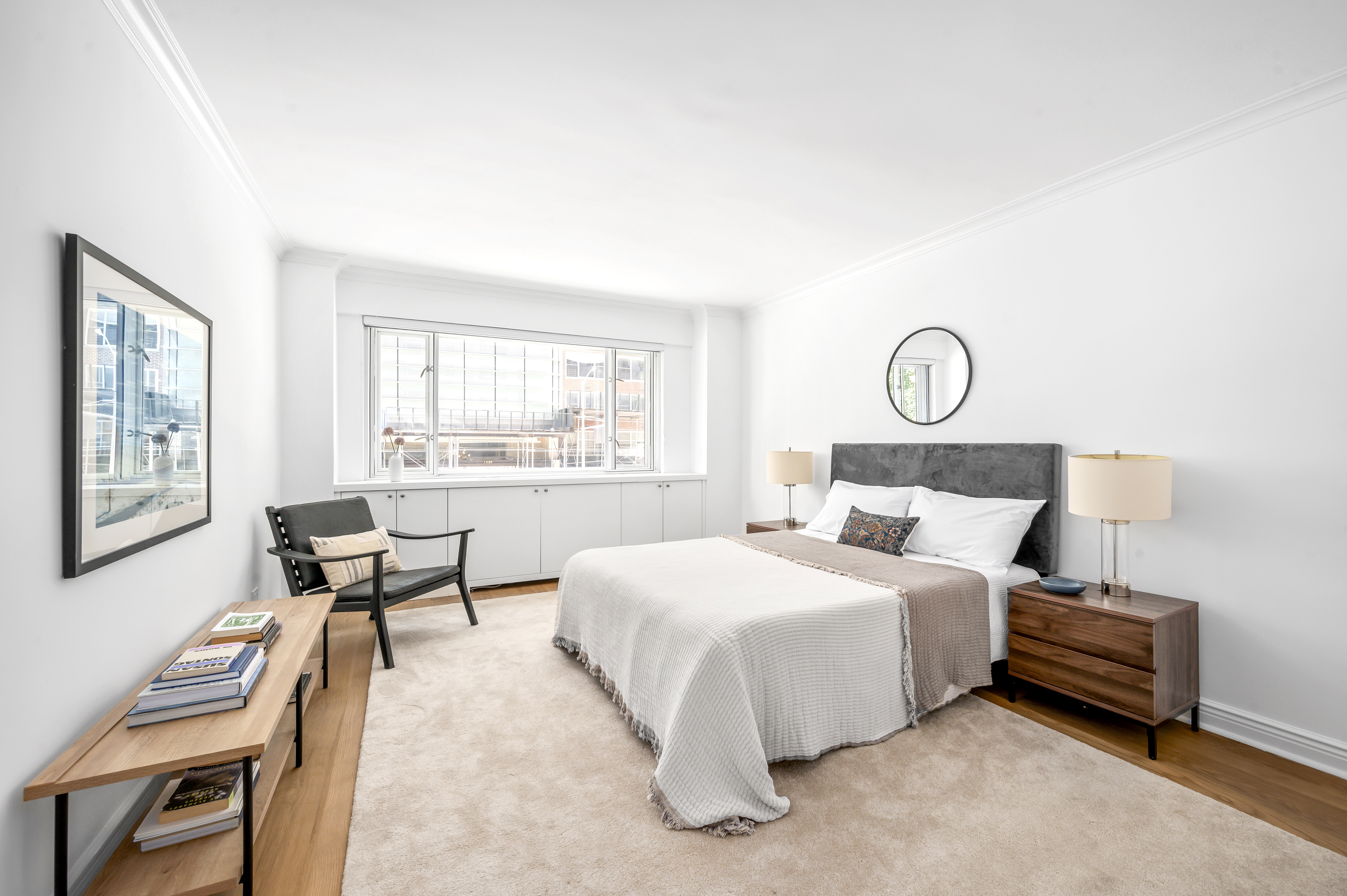 166 East 63rd Street, Unit 2J Manhattan, NY 10065 - Photo 12 of 14 a bedroom with a bed and a window