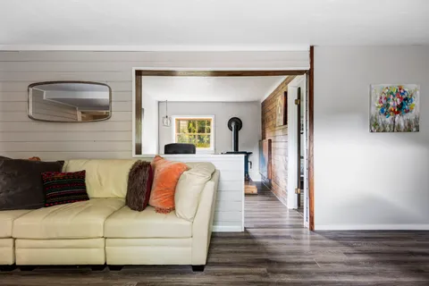 a bedroom with a bed and a potted plant