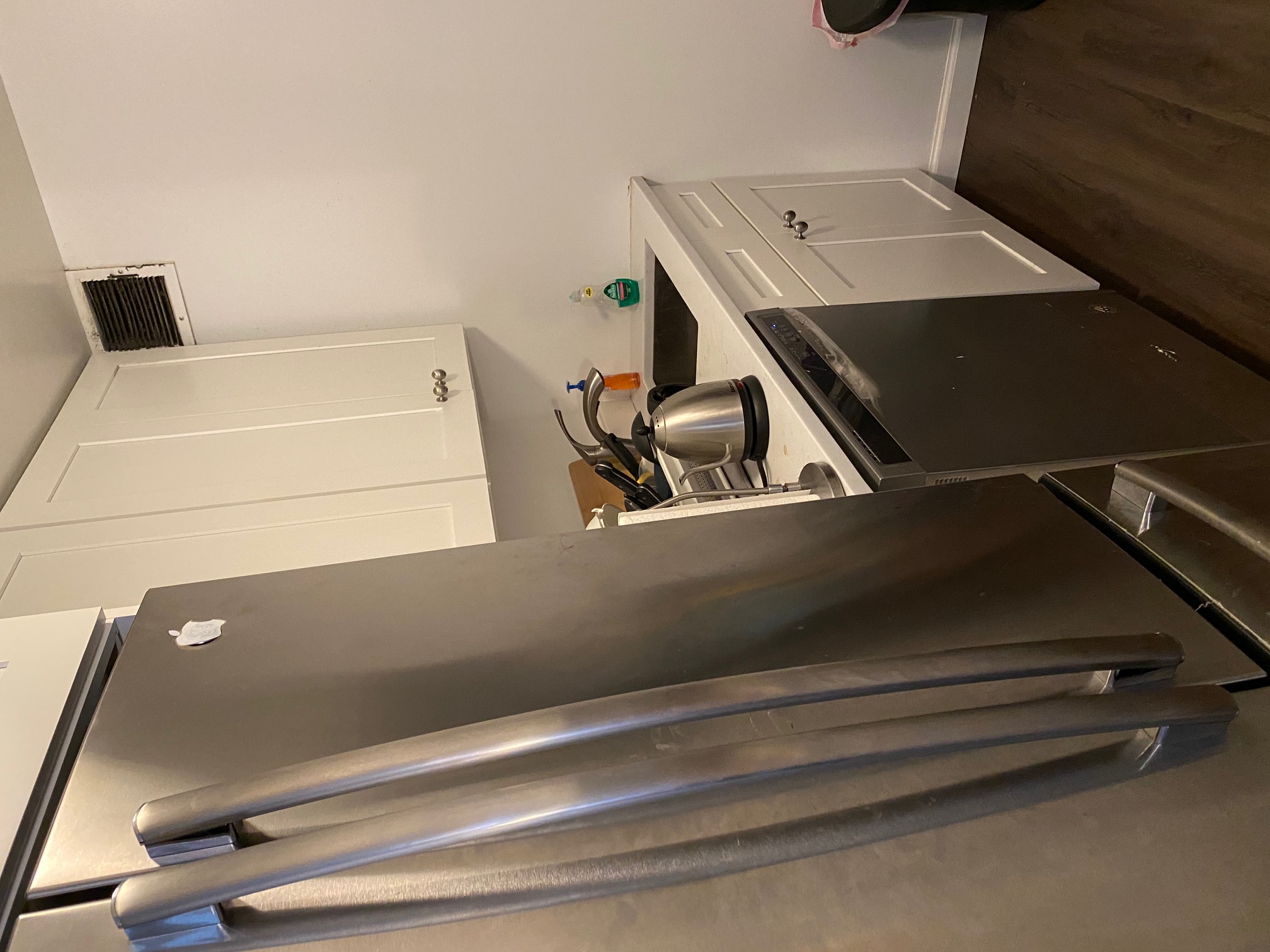 50 Lexington Avenue, Unit 18D Manhattan, NY 10010 - Photo 5 of 12 a kitchen with white cabinets and sink