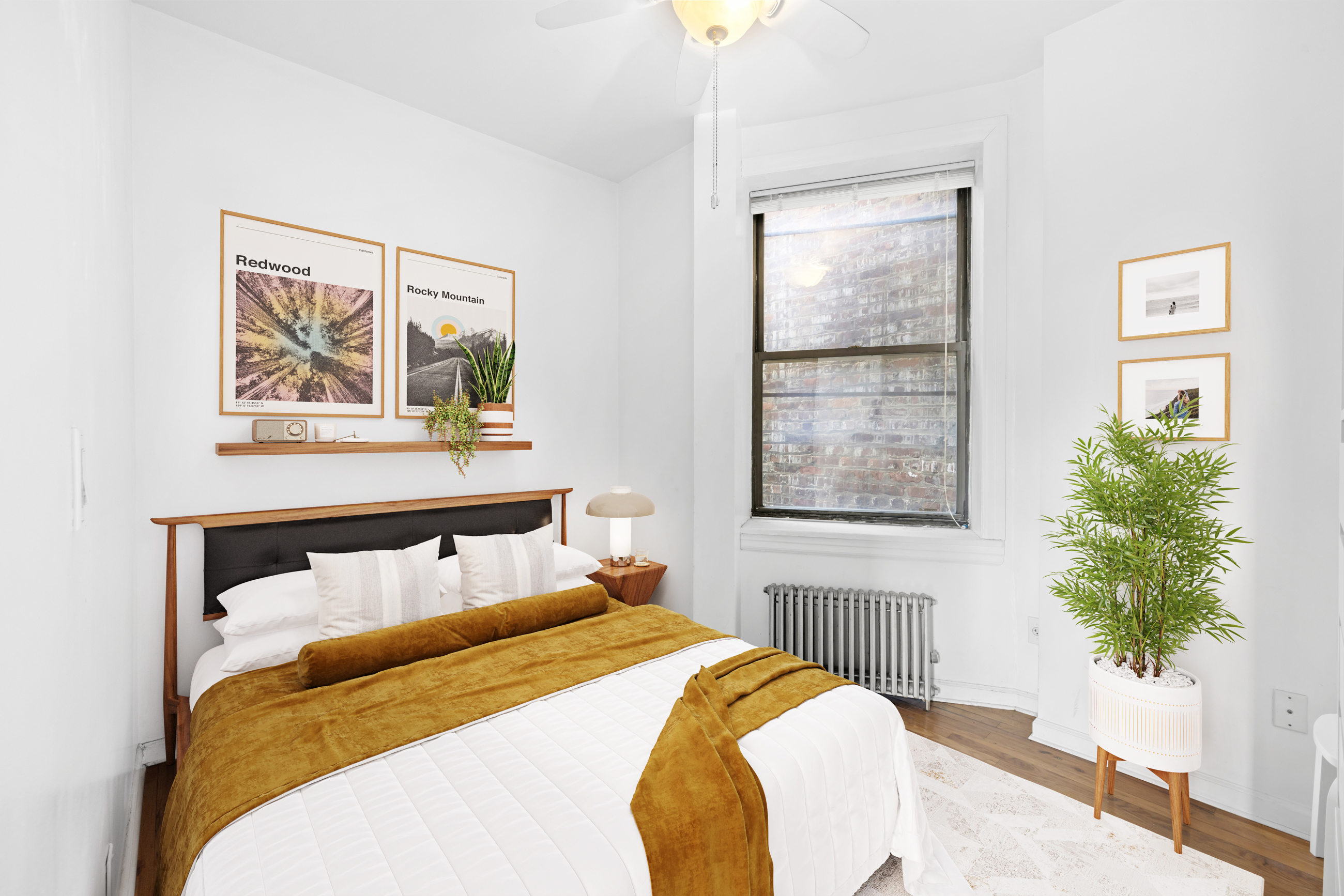 469 West 166th Street, Unit 2C Manhattan, NY 10032 - Photo 7 of 13 a bedroom with a bed and a potted plant