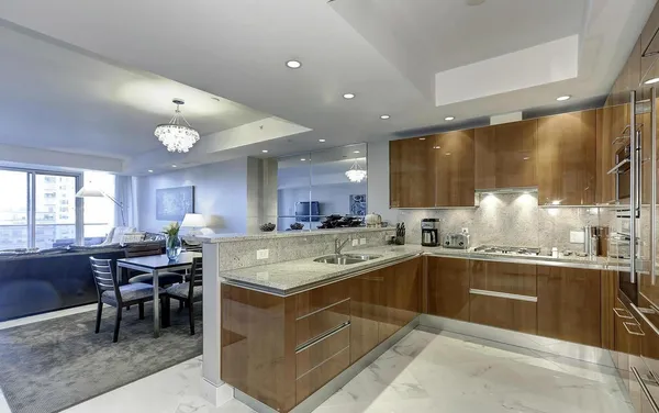 a kitchen with a sink and stove