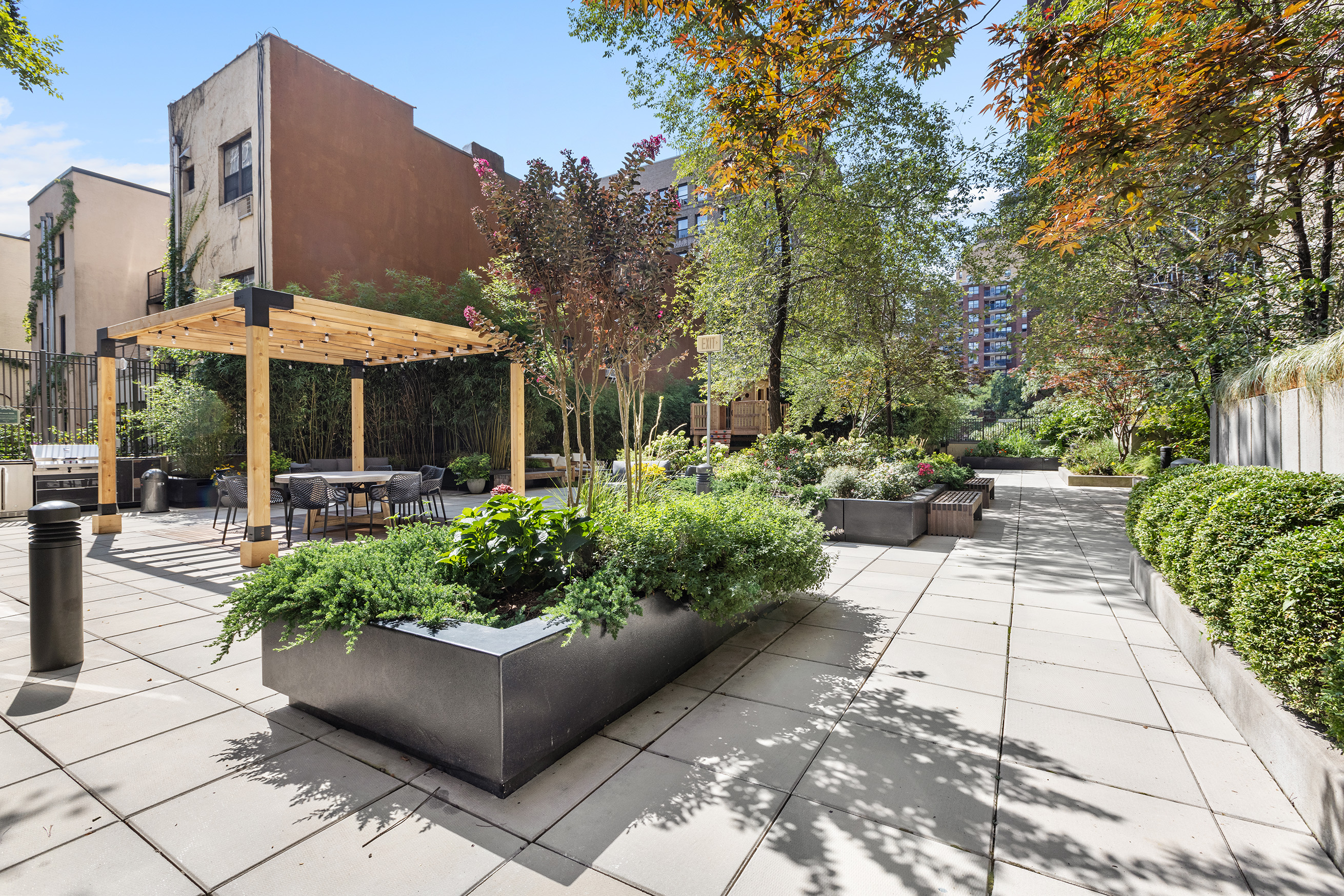 175 West 95th Street, Unit 10C Manhattan, NY 10025 - Photo 16 of 17 a view of a patio with furniture and a garden