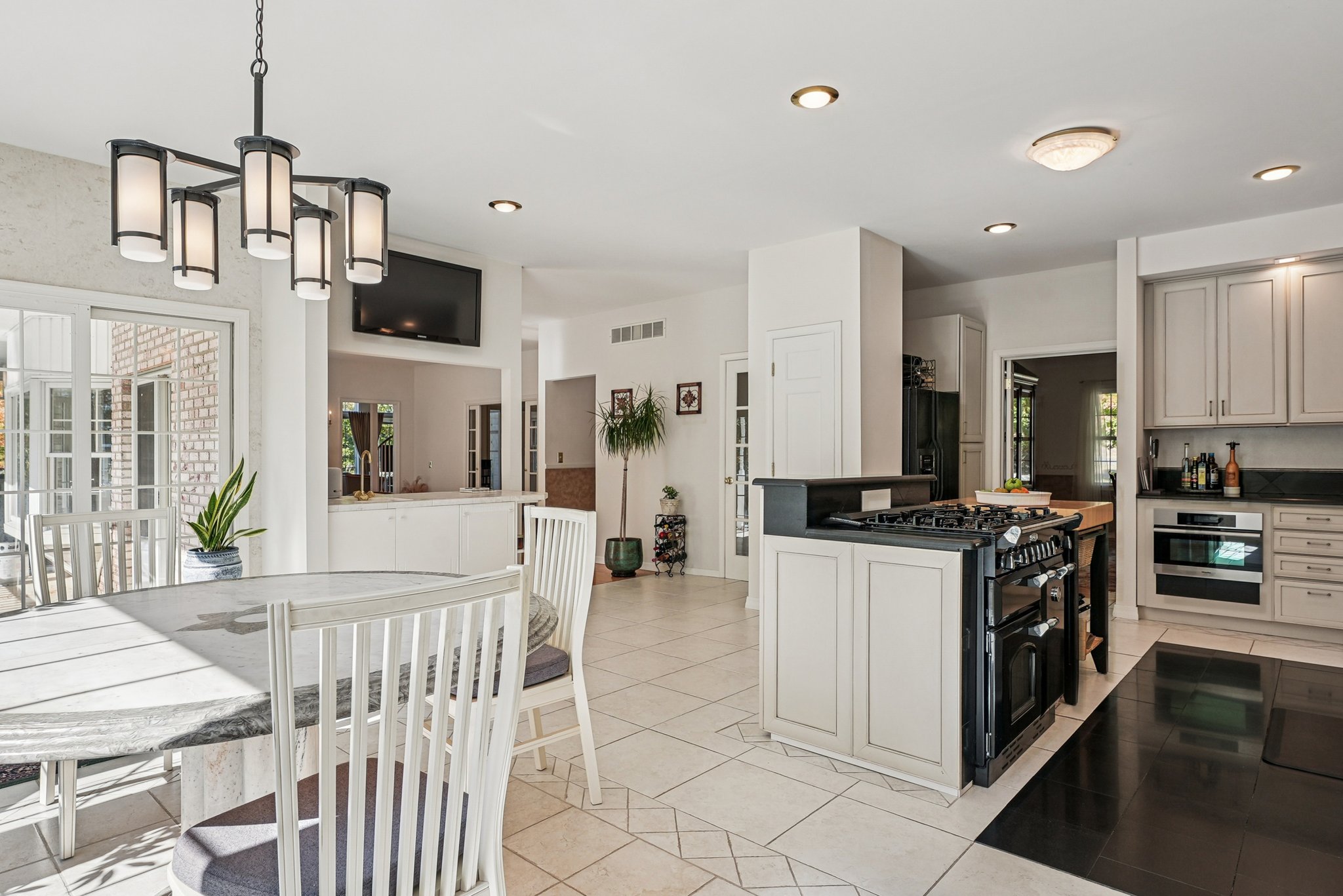 905 Kip Lane Neshanic Station, NJ 08853 - Photo 15 of 50 a kitchen with stainless steel appliances kitchen island granite countertop a stove a sink and a refrigerator