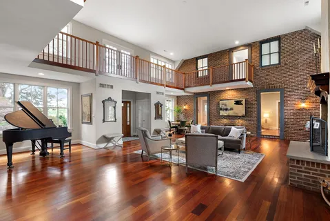 a living room with furniture or window and a wooden floor