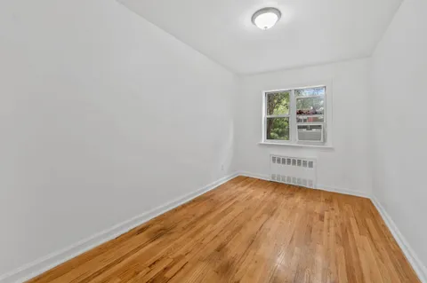 a view of an empty room and a window