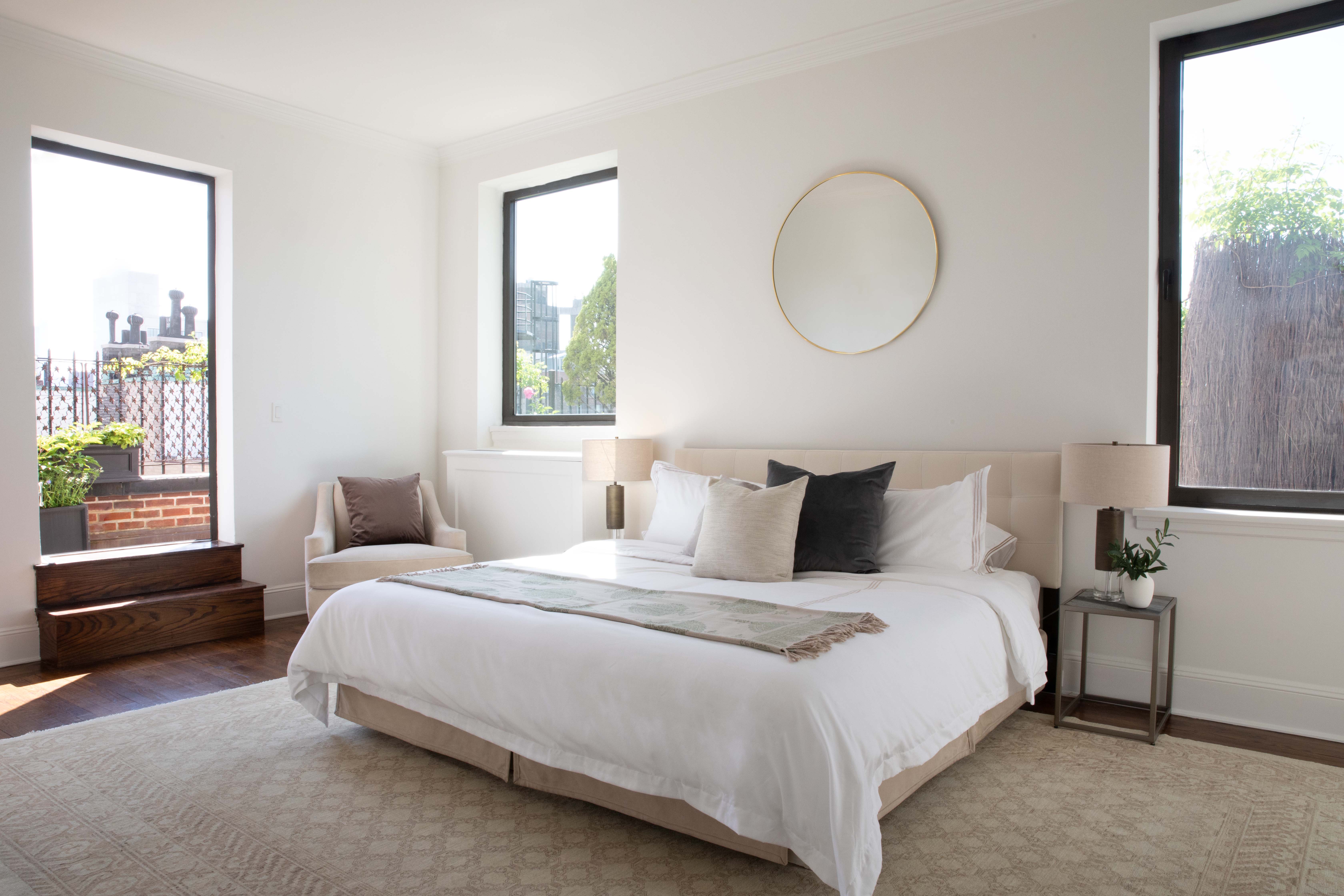 1070 Park Avenue, Unit PHE Manhattan, NY 10128 - Photo 6 of 14 a bedroom with bed and a window