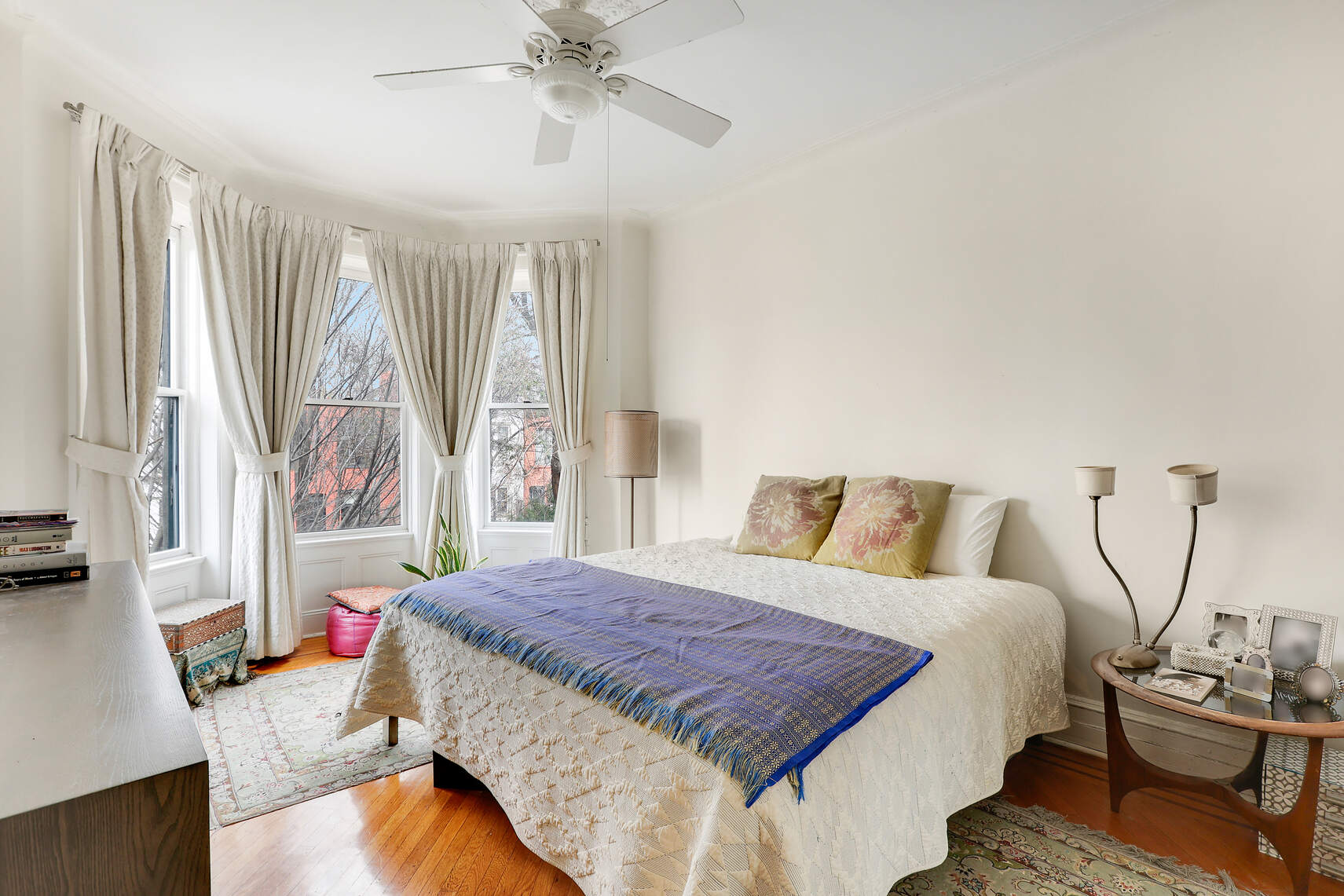 261 Fenimore Street Brooklyn, NY 11225 - Photo 12 of 21 a bedroom with a large bed and a chandelier